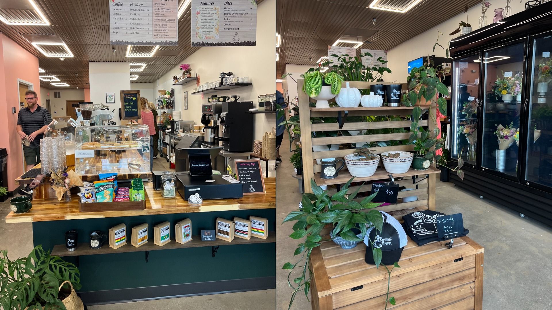 Interior of a coffee shop with wooden counters displaying snacks, coffee bags, and a cash register. Shelves with plants, white pumpkin decorations, hats, and T-shirts. Refrigerated flowers in the background.