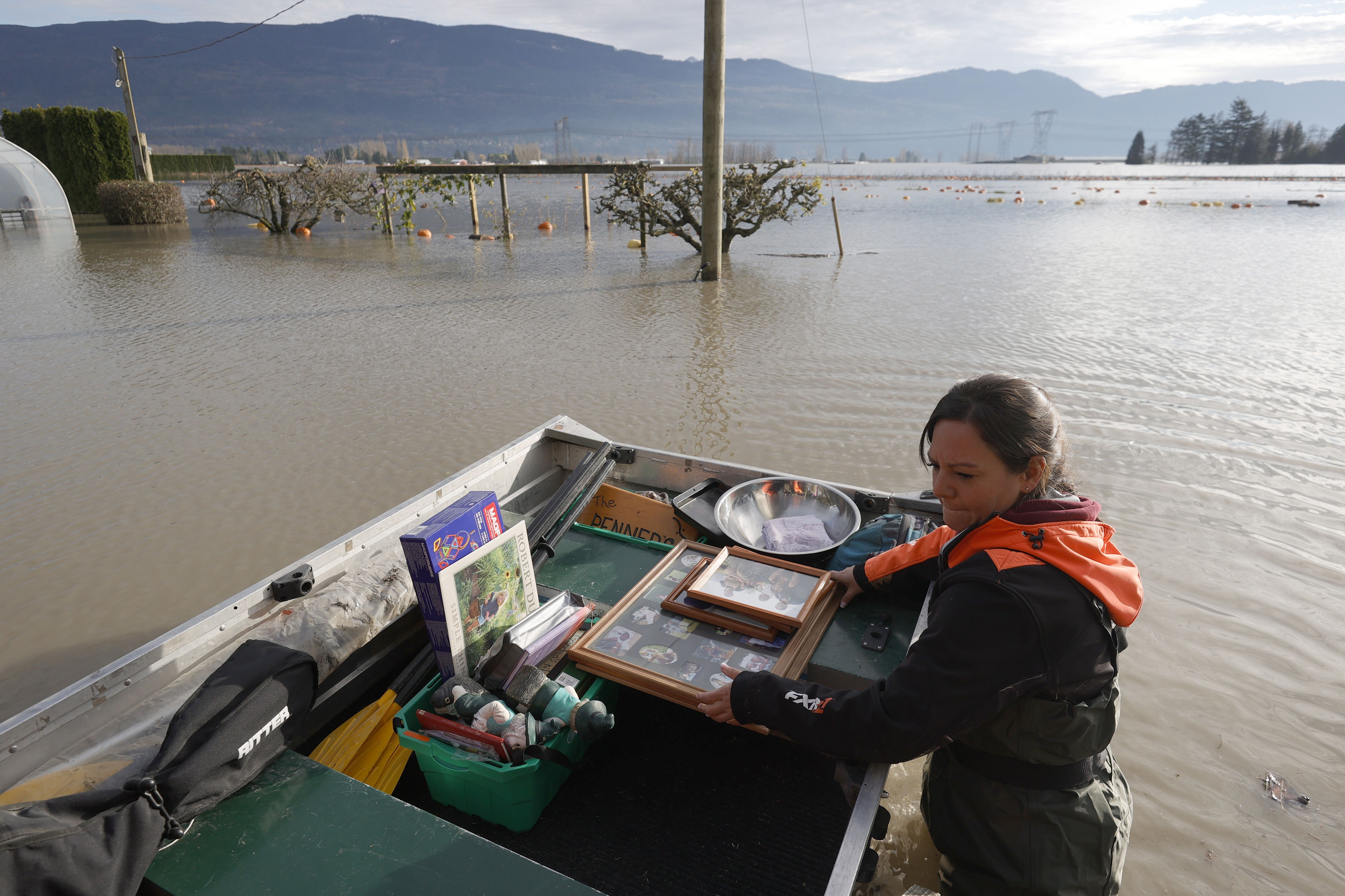 A woman loads personal items from a flooded home in Abbotsford, British Columbia, Canada, on Sunday. 
