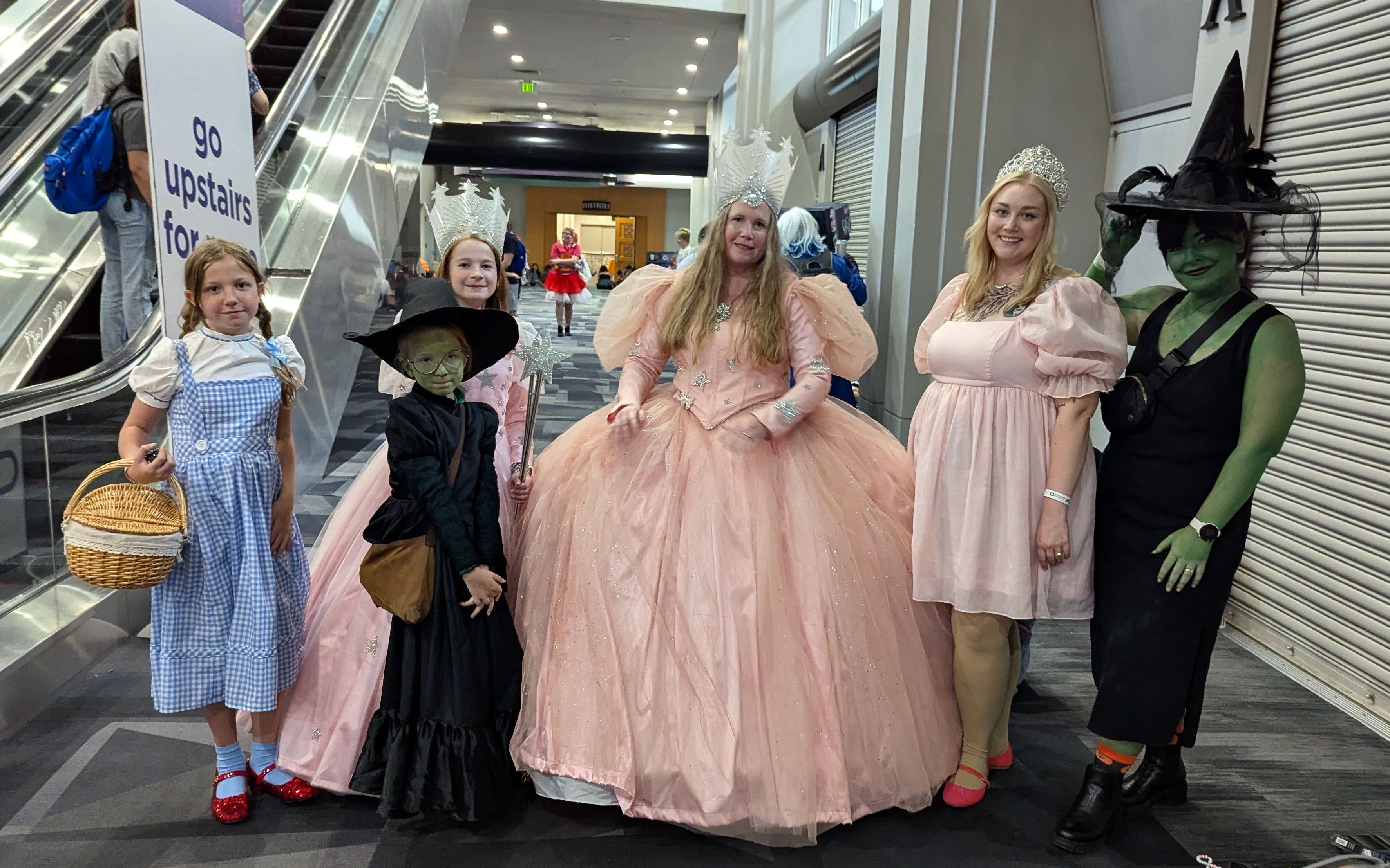 Women and girls dressed as Glinda and Elpheba 