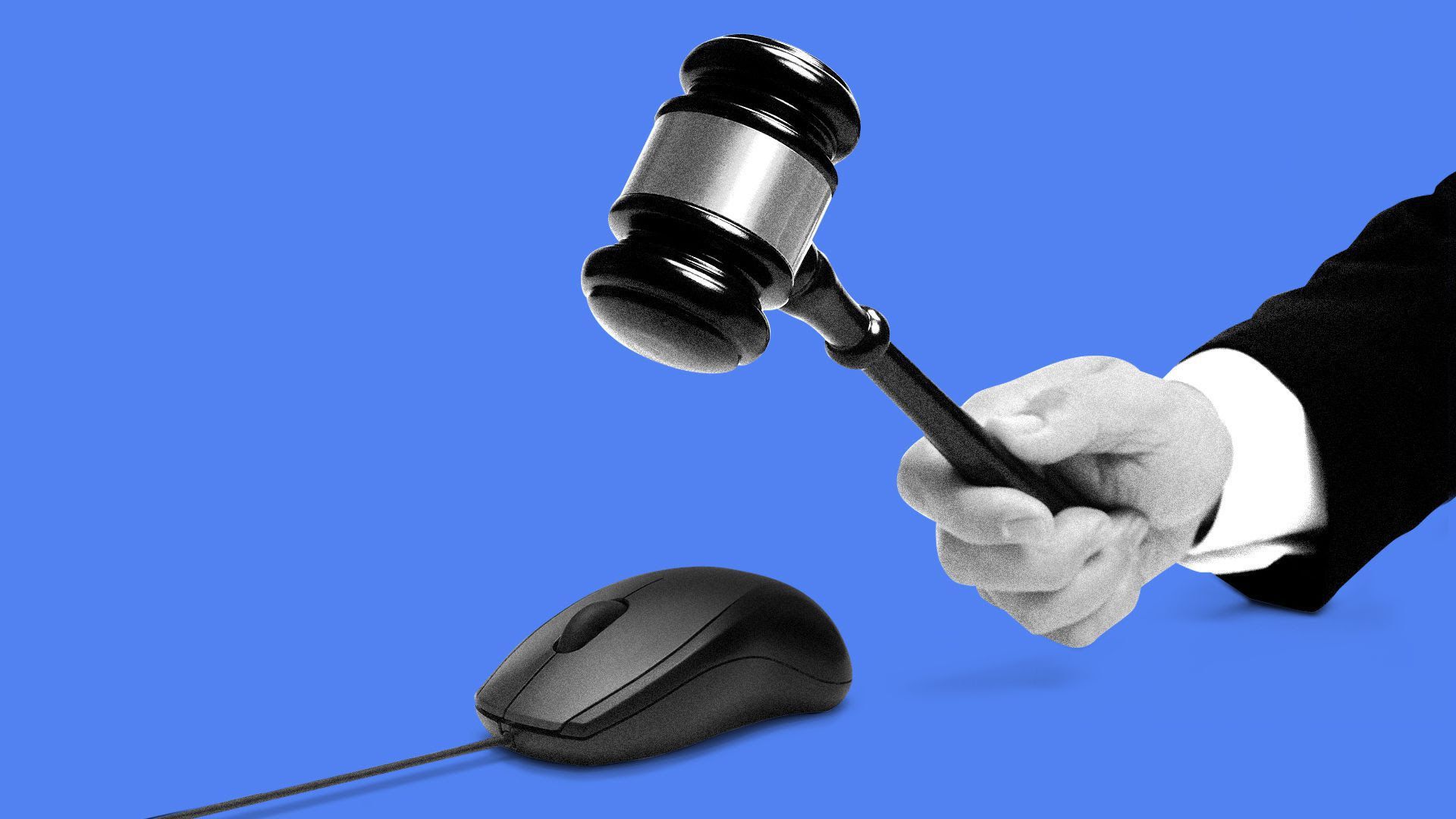 A hand holding a gavel, hovering above a computer mouse. 