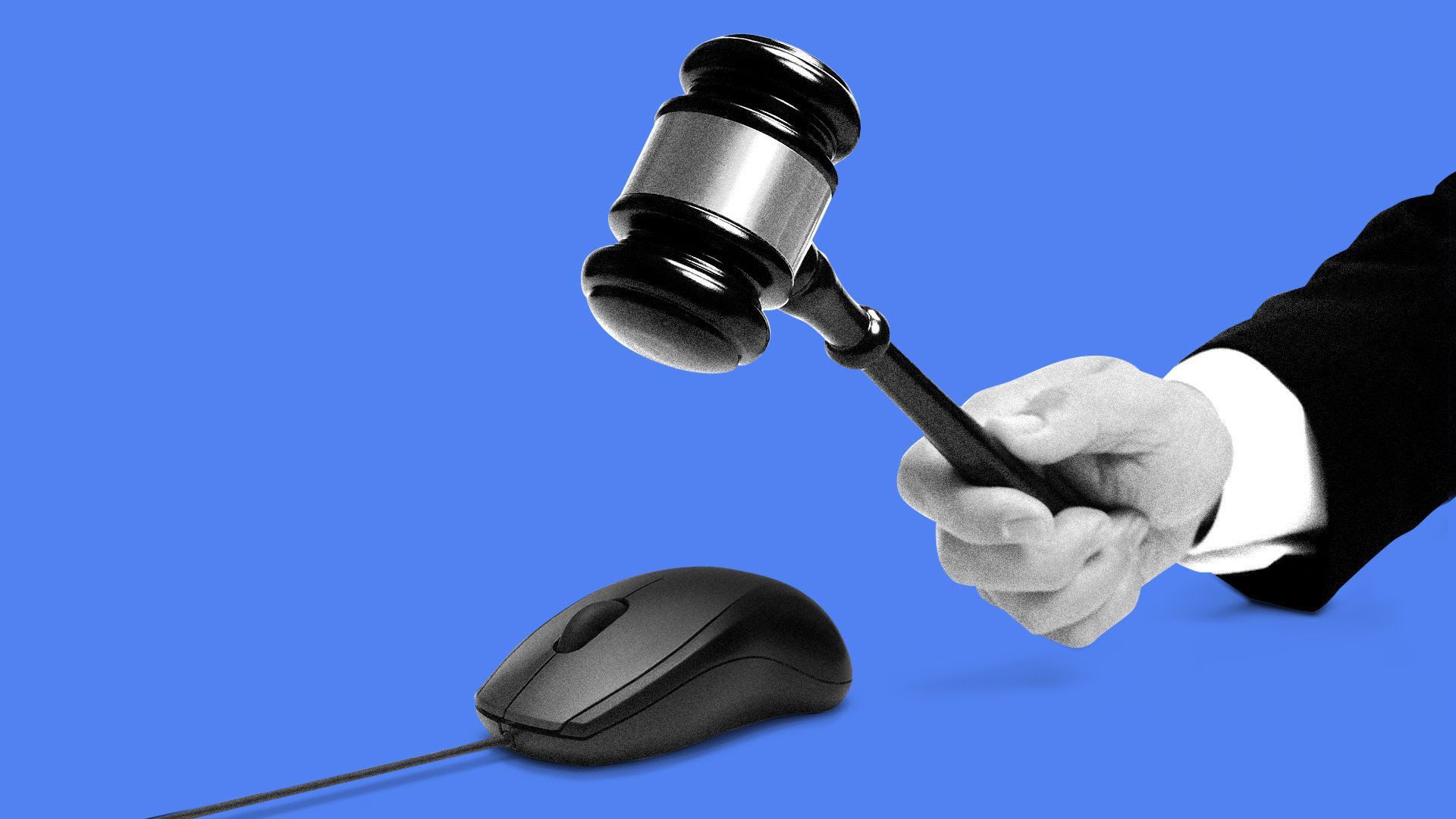 A hand holding a gavel, hovering above a computer mouse.