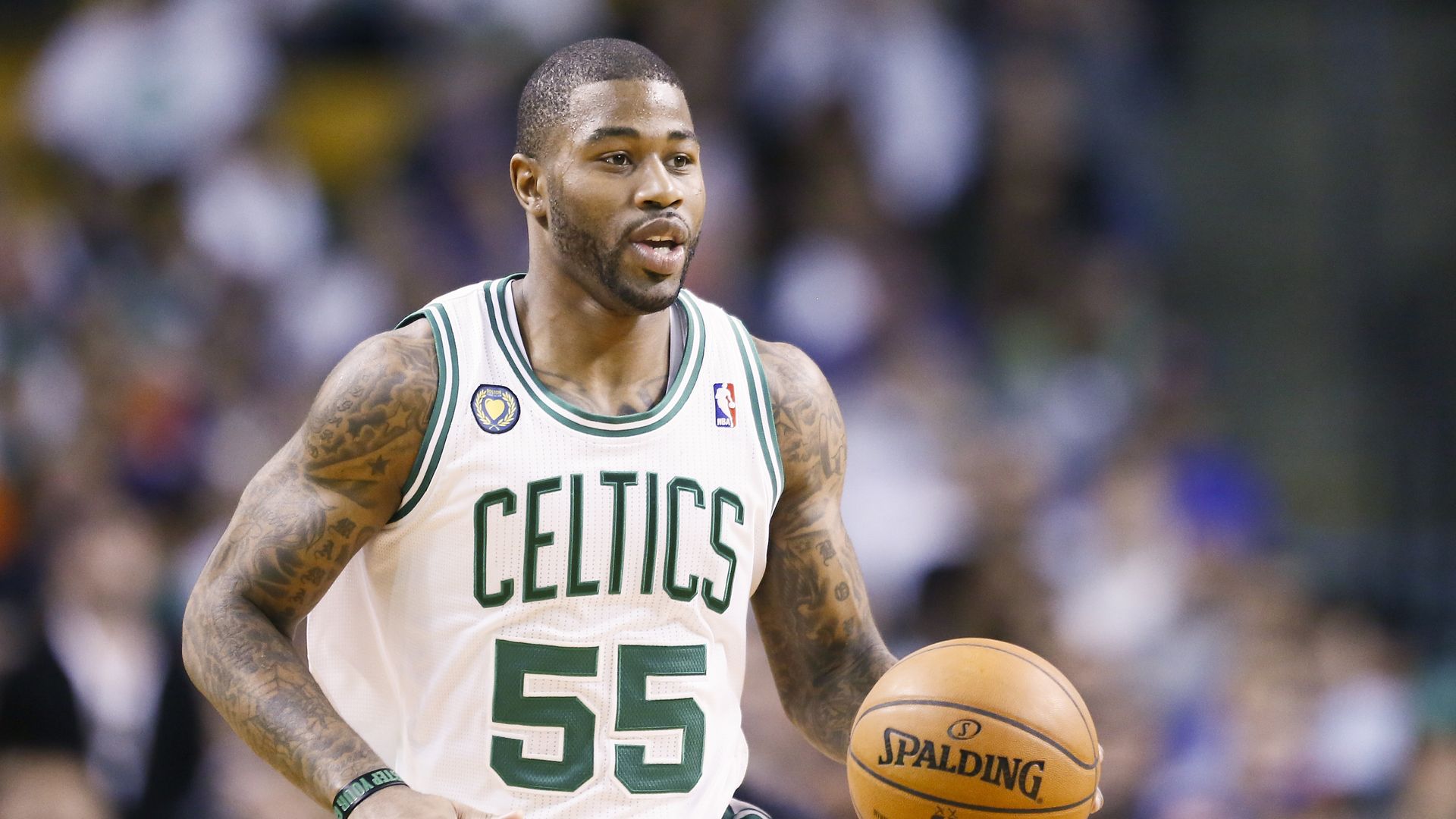 Picture of terrence Williams wearing a Celtics jersey and carrying a basketball