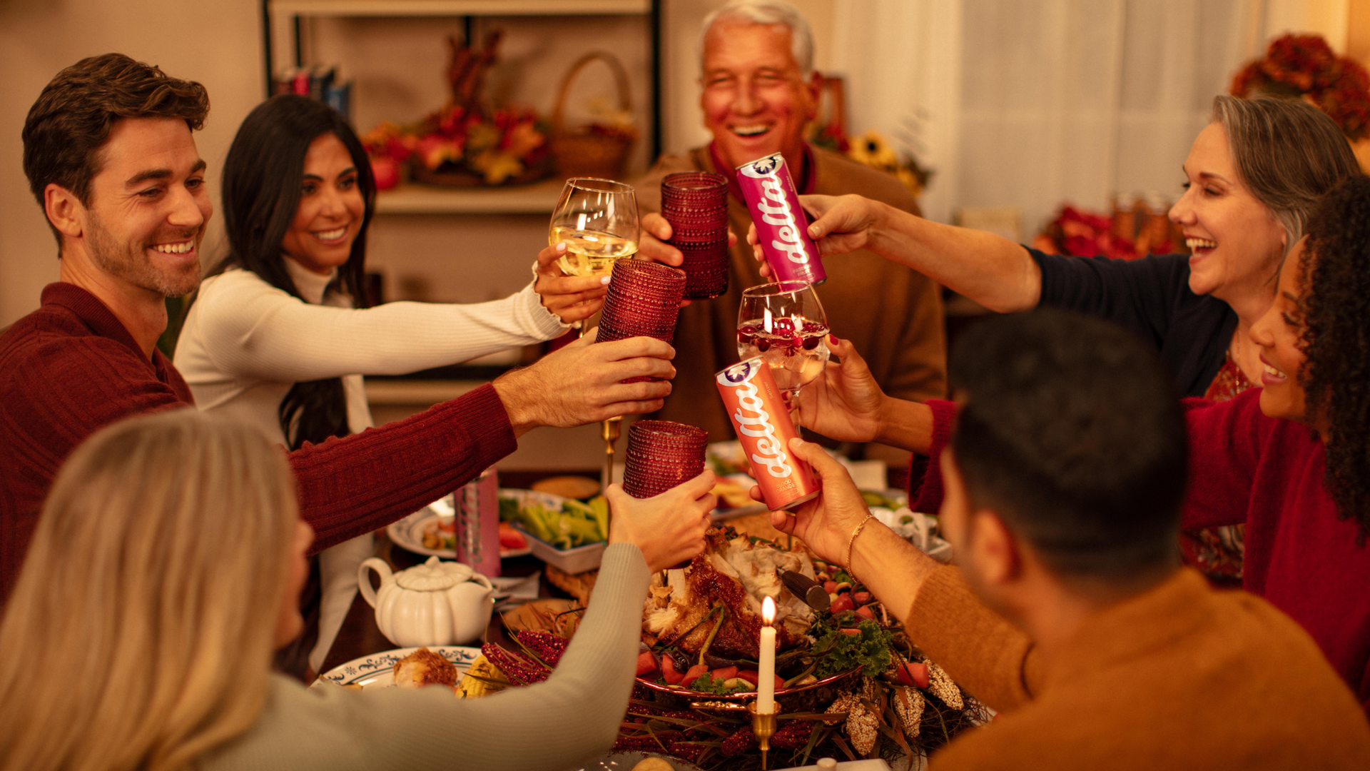 People toasting at a dinner table.