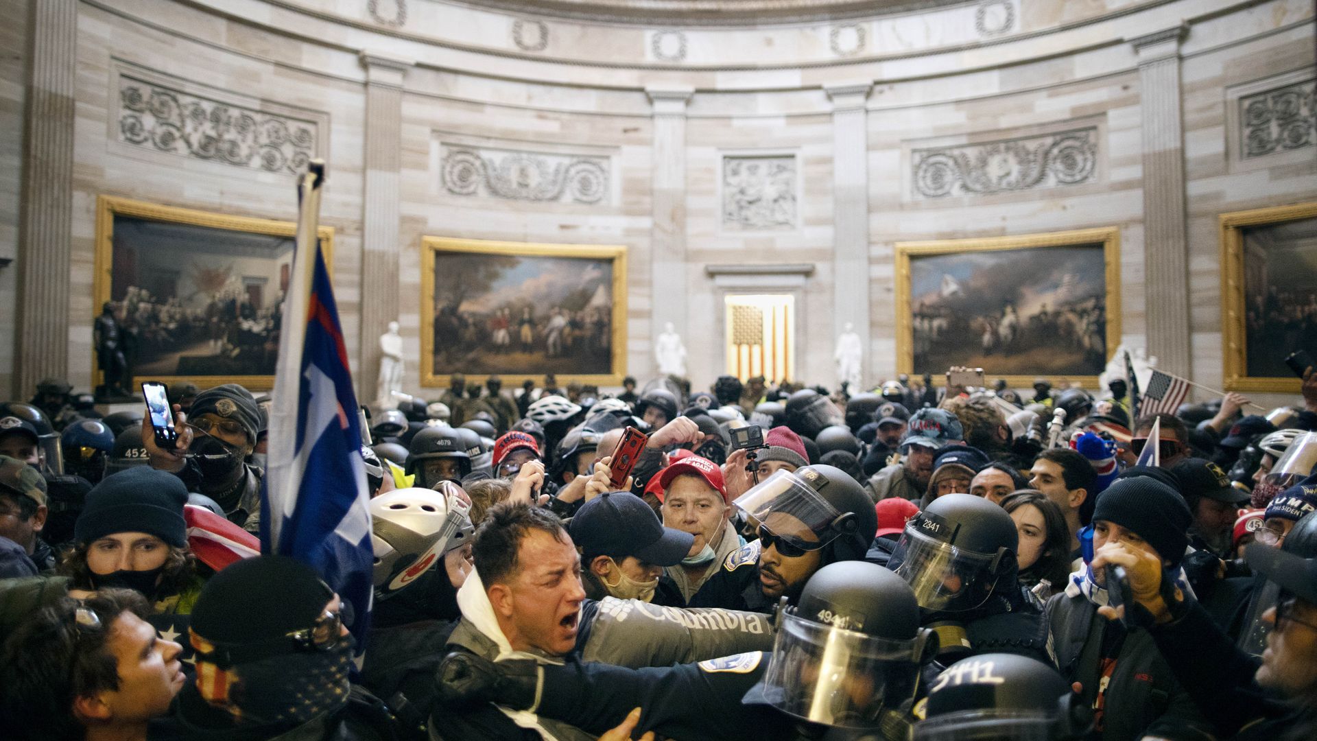 Protesters clash with police inside the Capitol rotunda on January 6.
