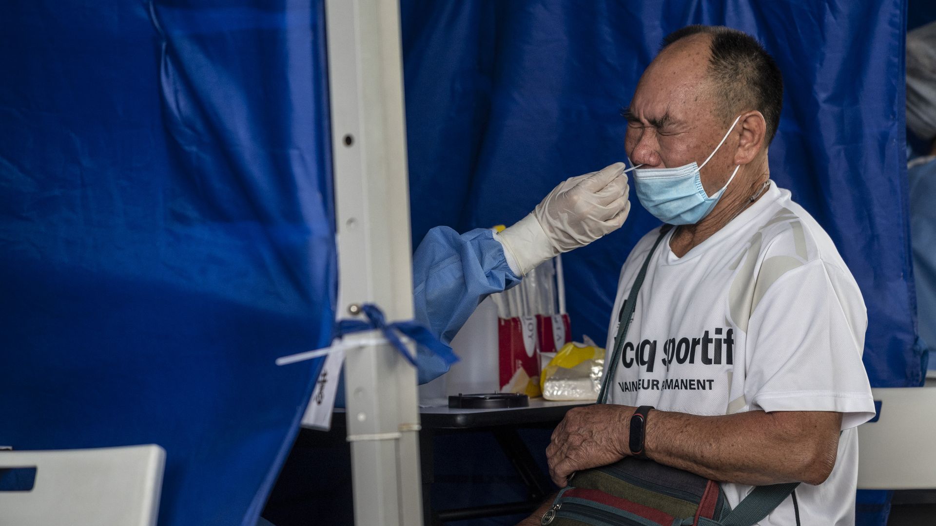 A man taking a Covid-19 PCR test at Shenzhen Bay Port.