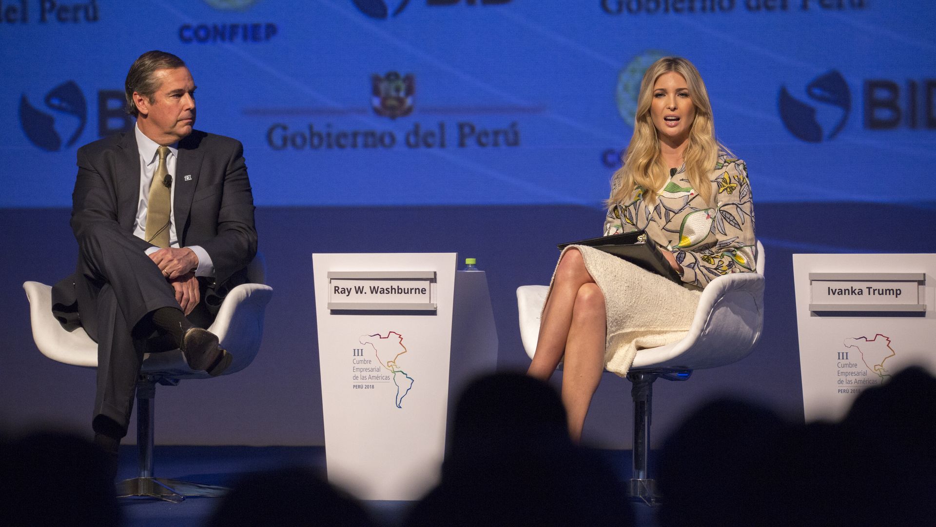 US President and CEO of the Overseas Private Investment Corporation Ray W. Washburne and US Presidential Advisor Ivanka Trump speak