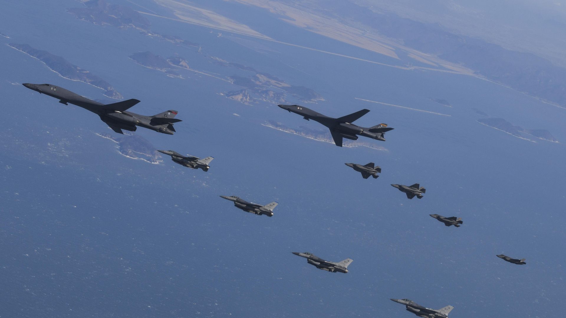 U.S. Air Force B-1B bombers, F-16 fighter jets and South Korean Air Force F-35A fighter jets fly over South Korea Peninsula during a joint air drill on February 19, 2023