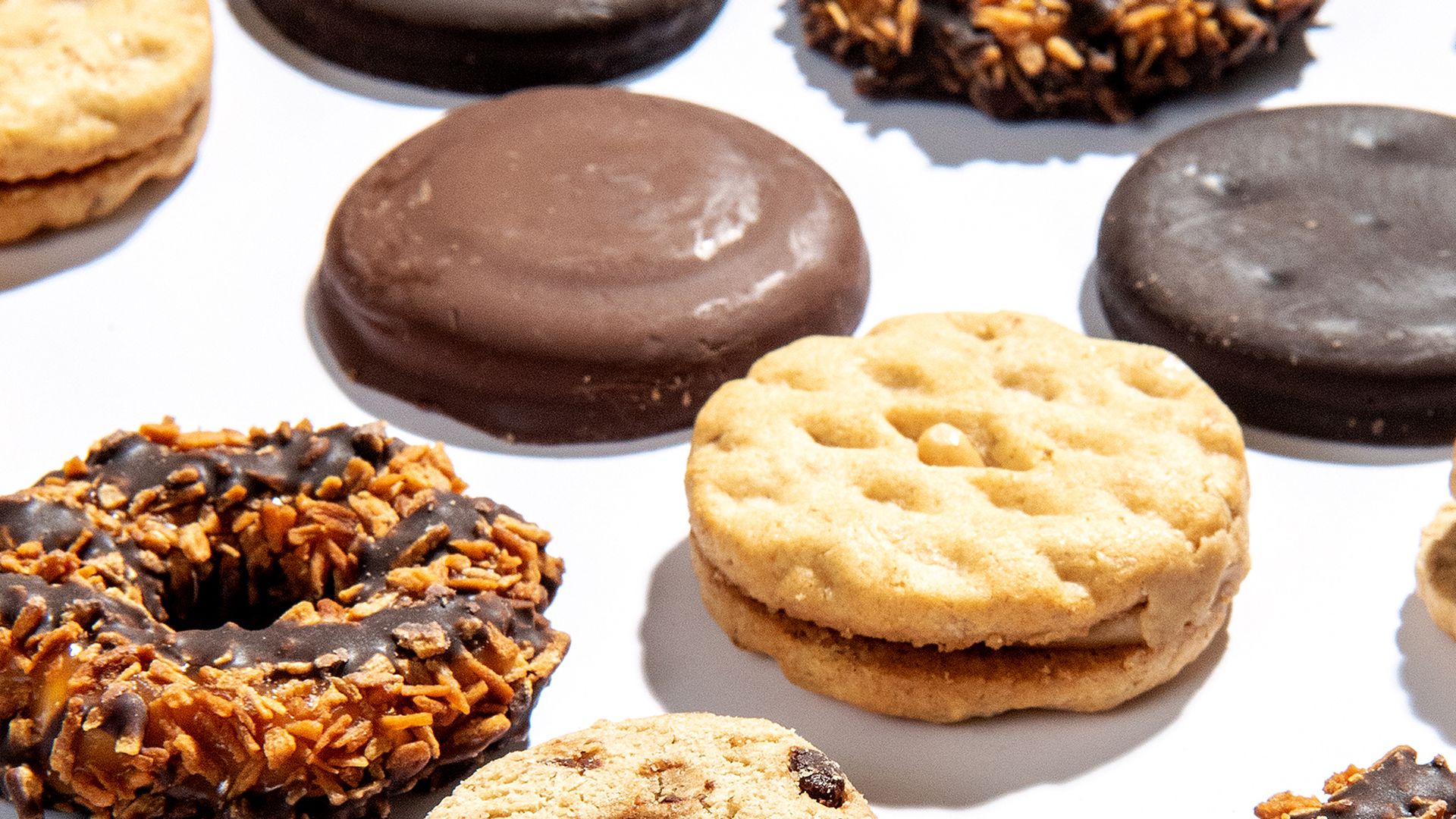 Several Girl Scout cookies photographed on a table, from an angle.