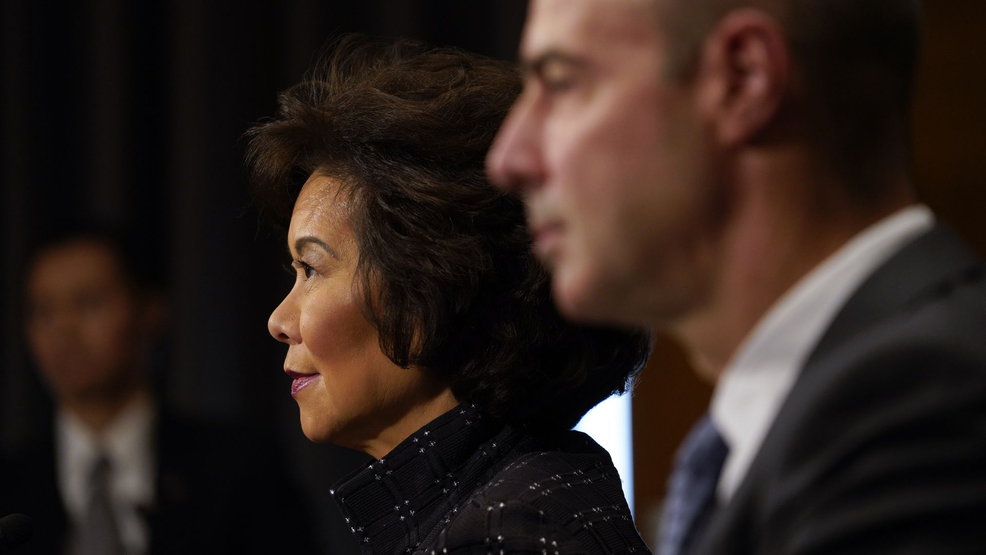 Photo of Elaine Chao's side profile in focus