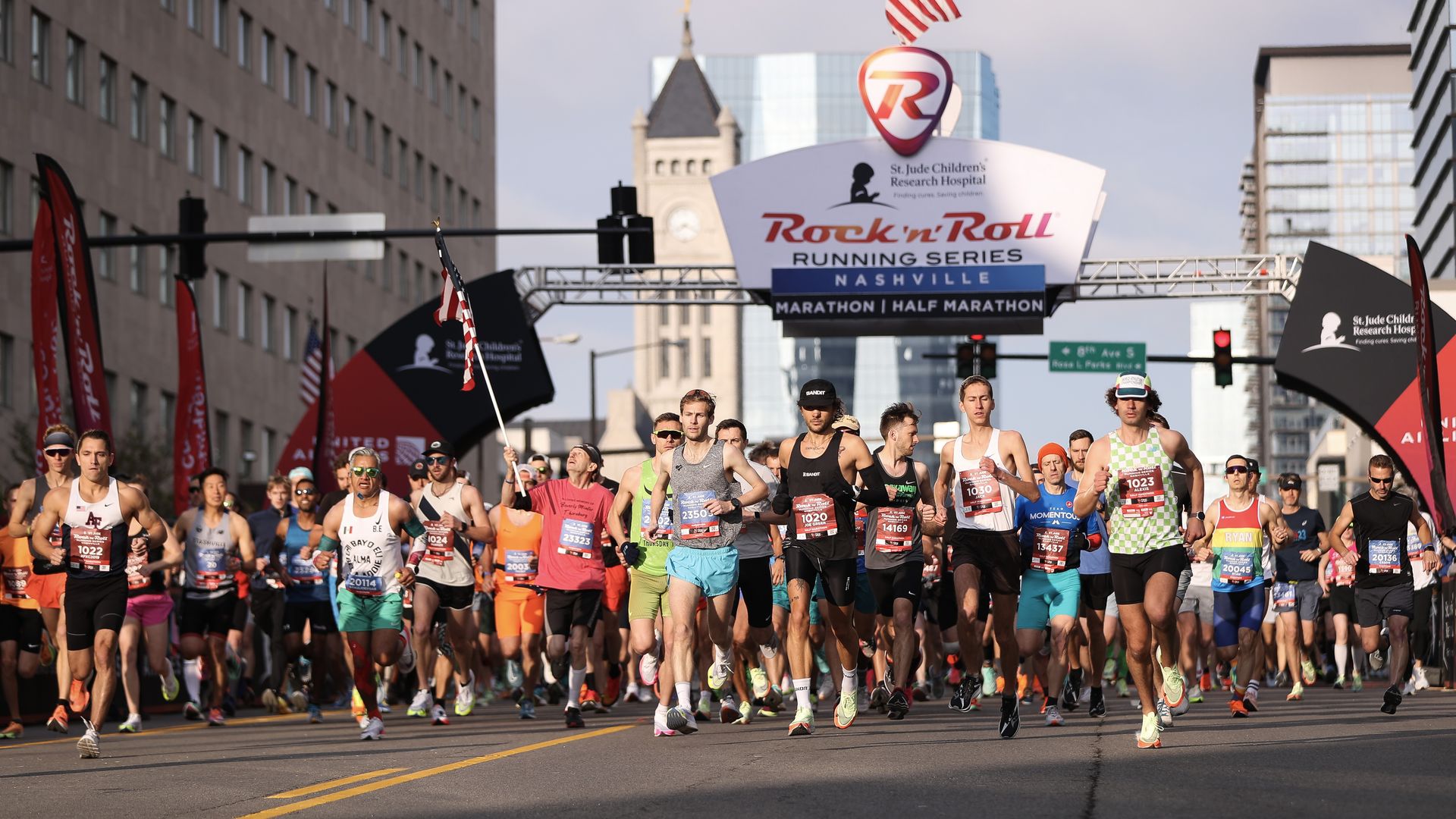 Runners cross the starting line at the Rock 'n' Roll marathon and half marathon in 2023.