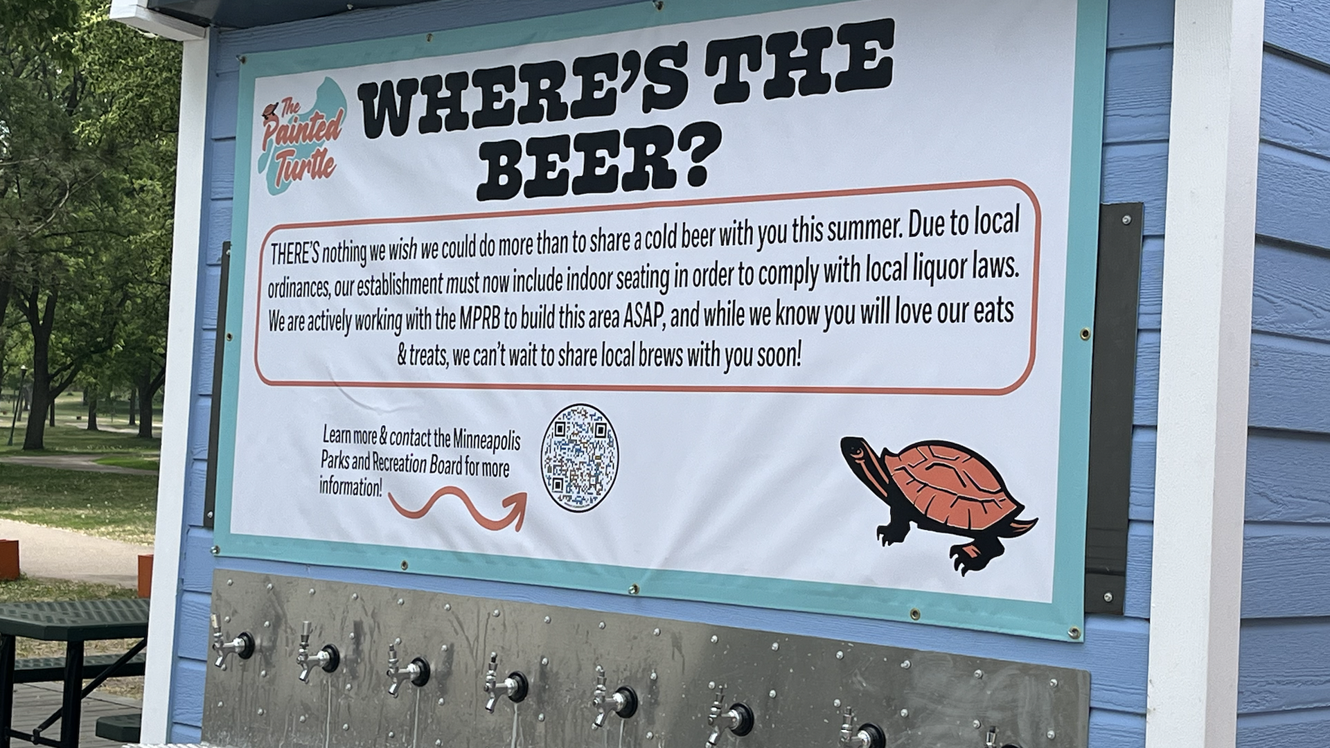 sign above row of taps that says where's the beer and explains a local ordinacne issue