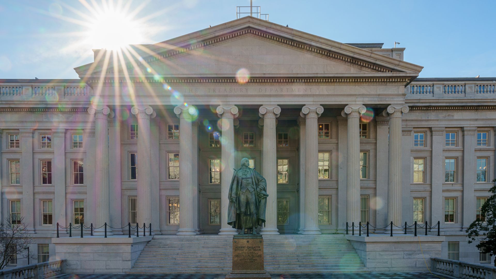 The sun flares over the U.S. Treasury department