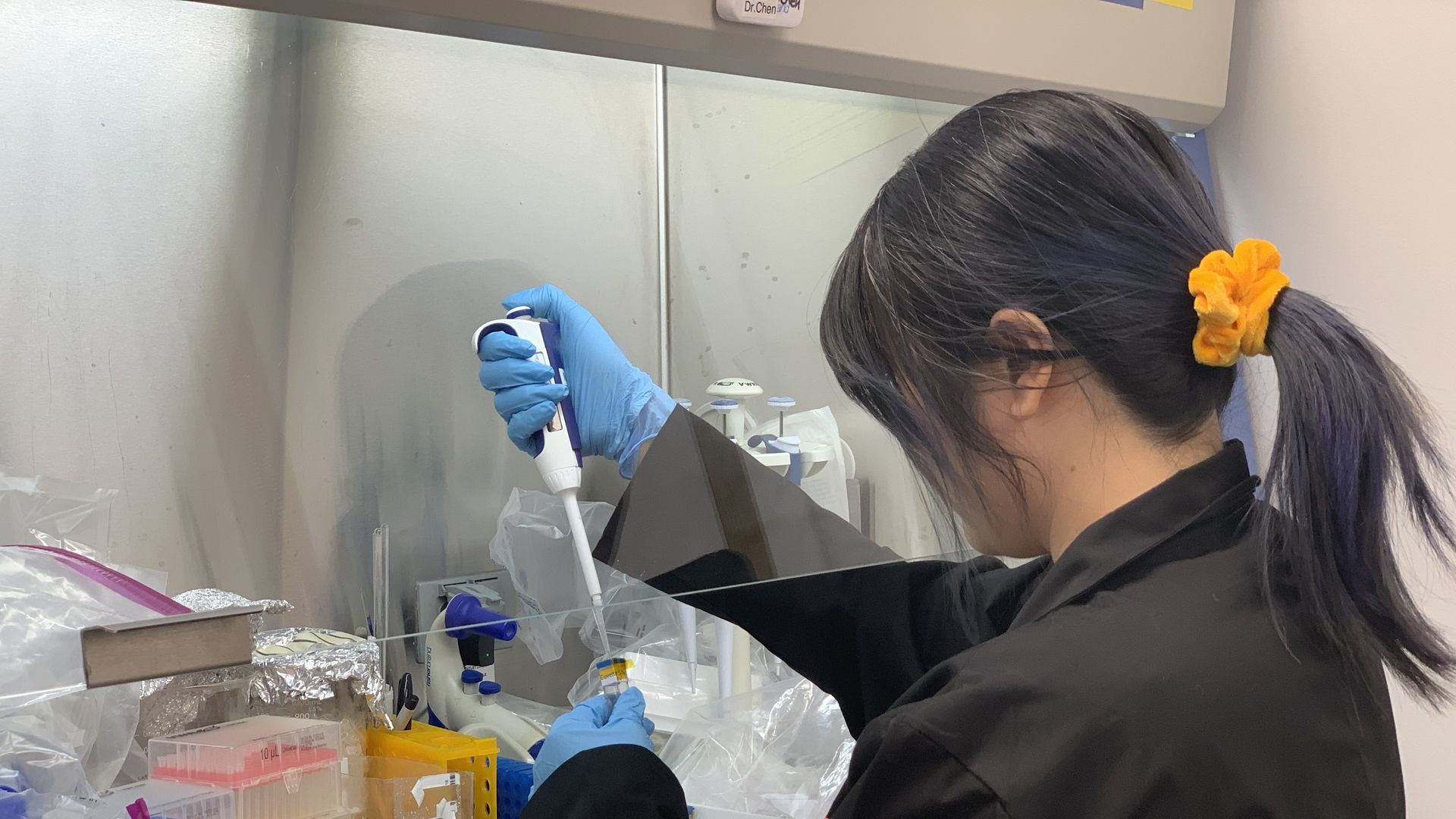 Anne Yau, a post-doc worker at the UConn lab, is "practice" prepping samples for Eascra's mission flight kit. Astronauts will use the kit to develop the nanomaterials when they go to space.