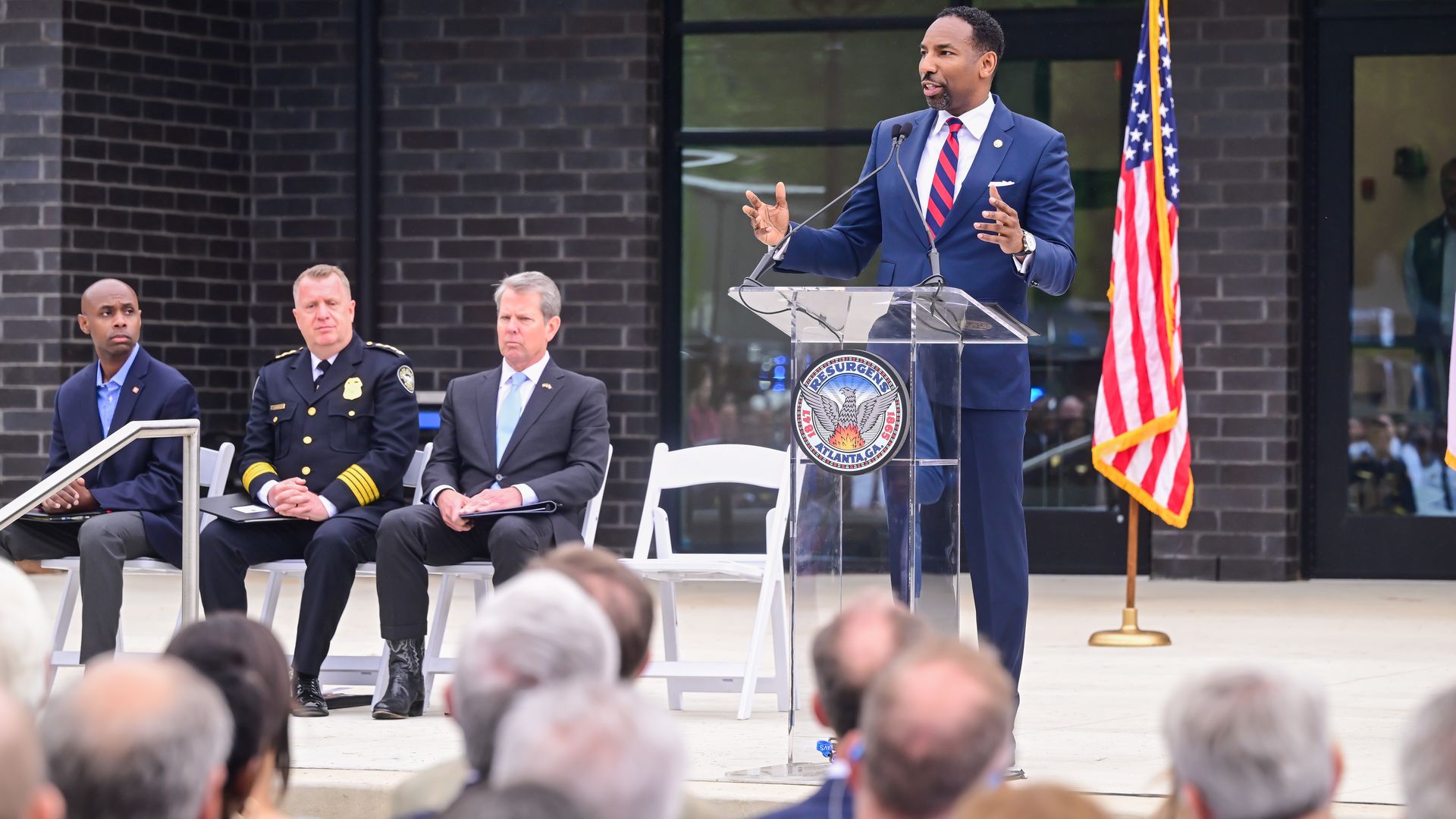 Andre Dickens, right, speaks at the ribbon cutting ceremony of the Atlanta Public Safety Training Center.