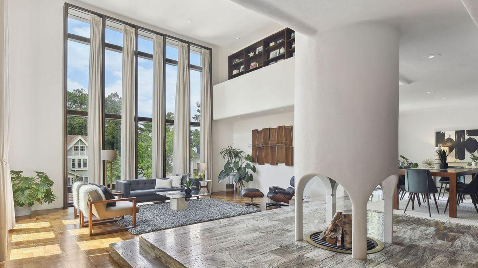 futuristic living room with stone level and fireplace