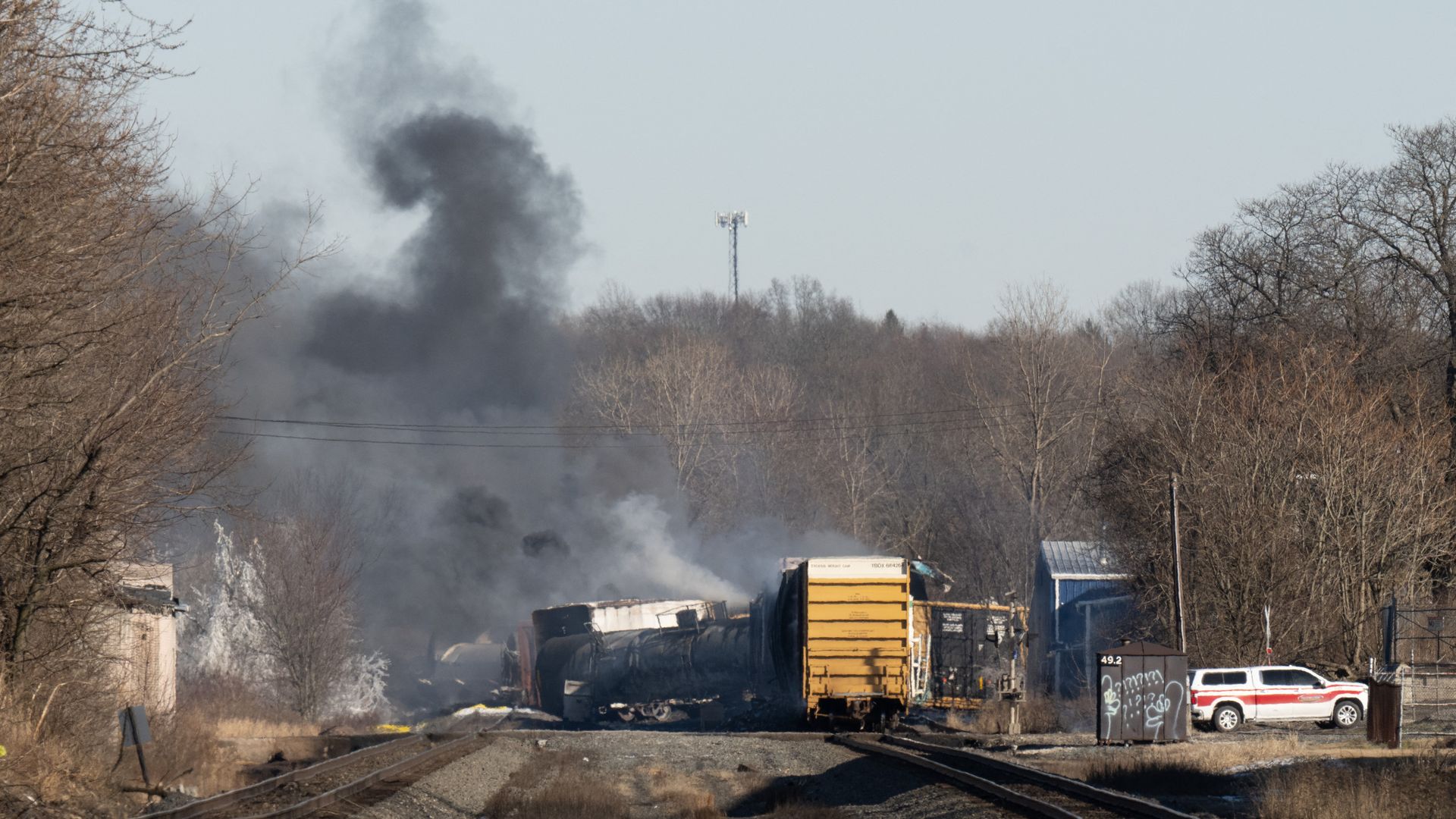 Smoke rises from a derailed cargo train in East Palestine, Ohio, on February 4, 2023.
