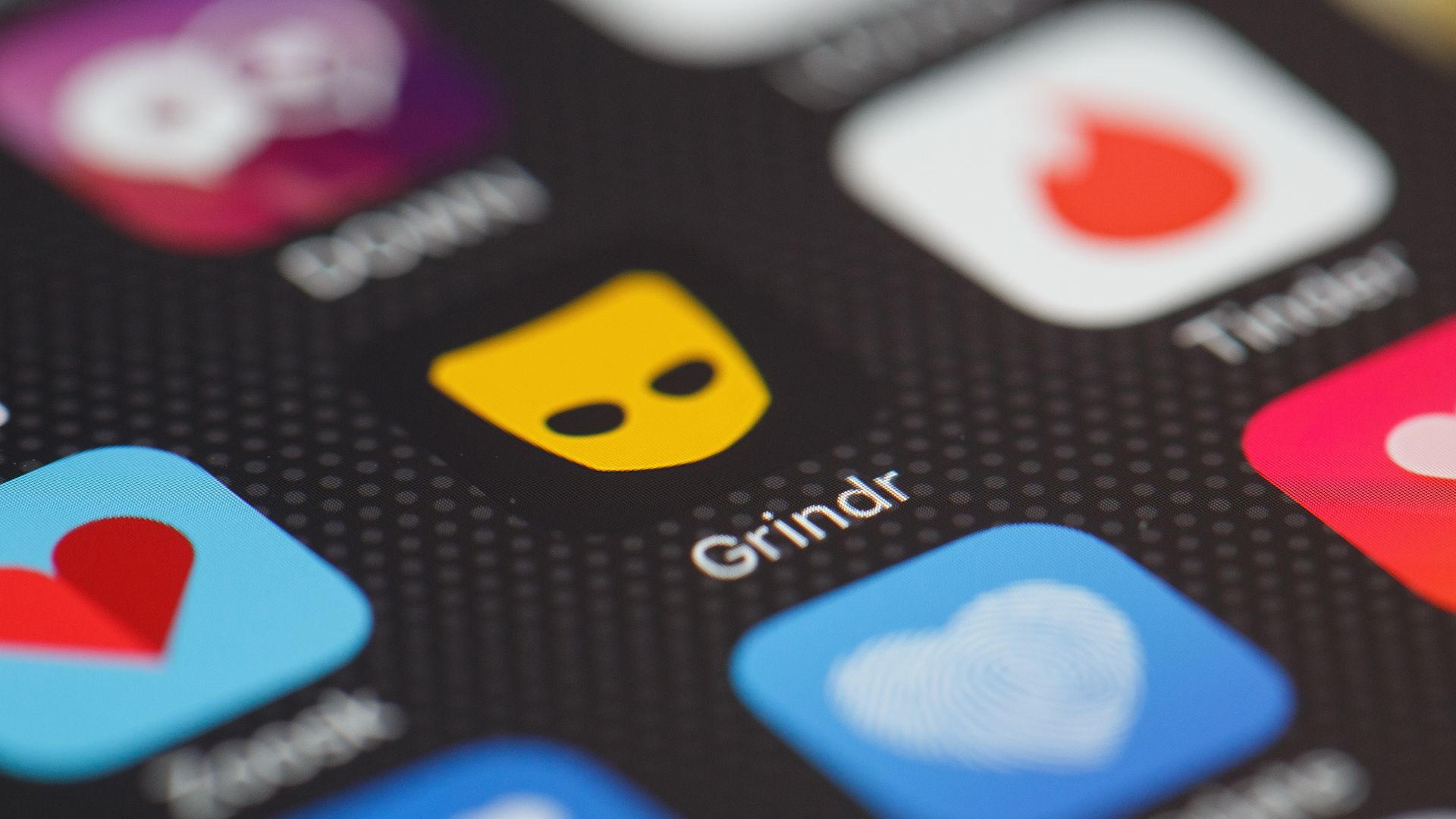  The 'Grindr' app logo is seen amongst other dating apps on a mobile phone screen.