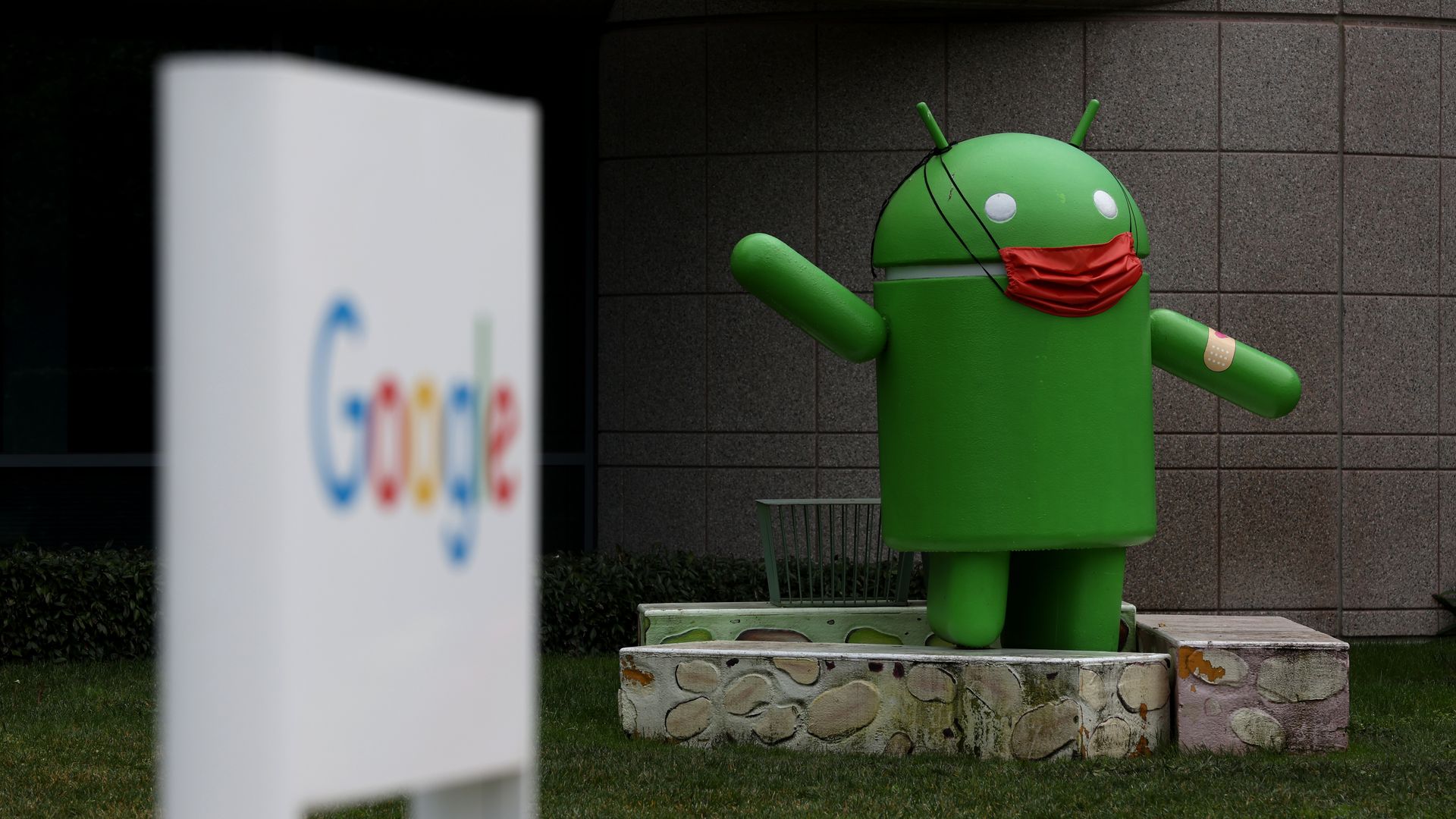 An Android statue near a Google sign at a Google campus in Mountain View, California.