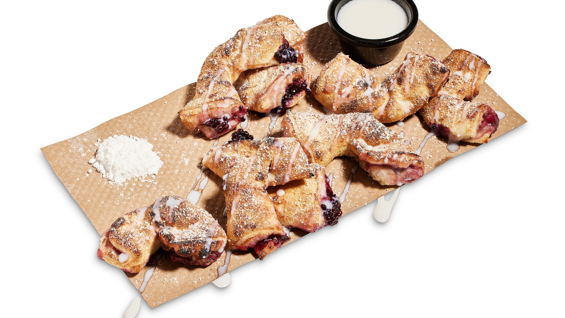 Marion Berry Knots, dough filled with marionberry jam, and white powdered sugar