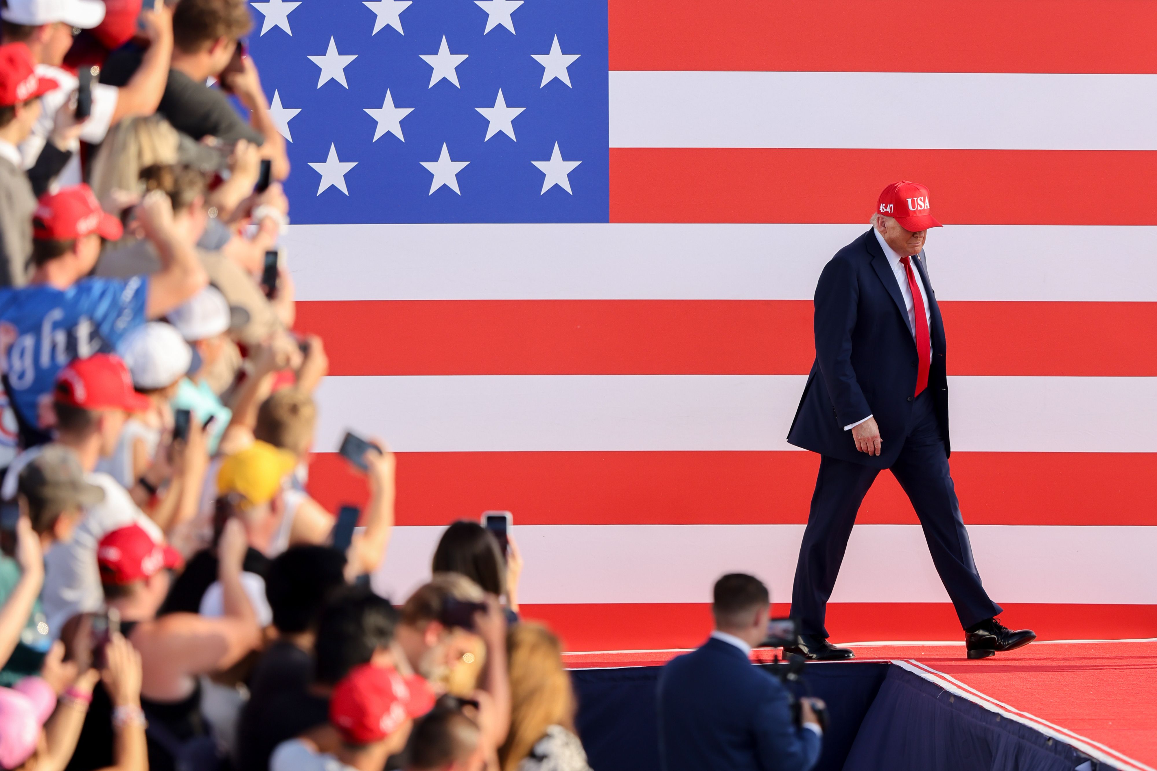 President Trump walks out at a rally at the Iowa State Fairgrounds in Des Moines last night.
