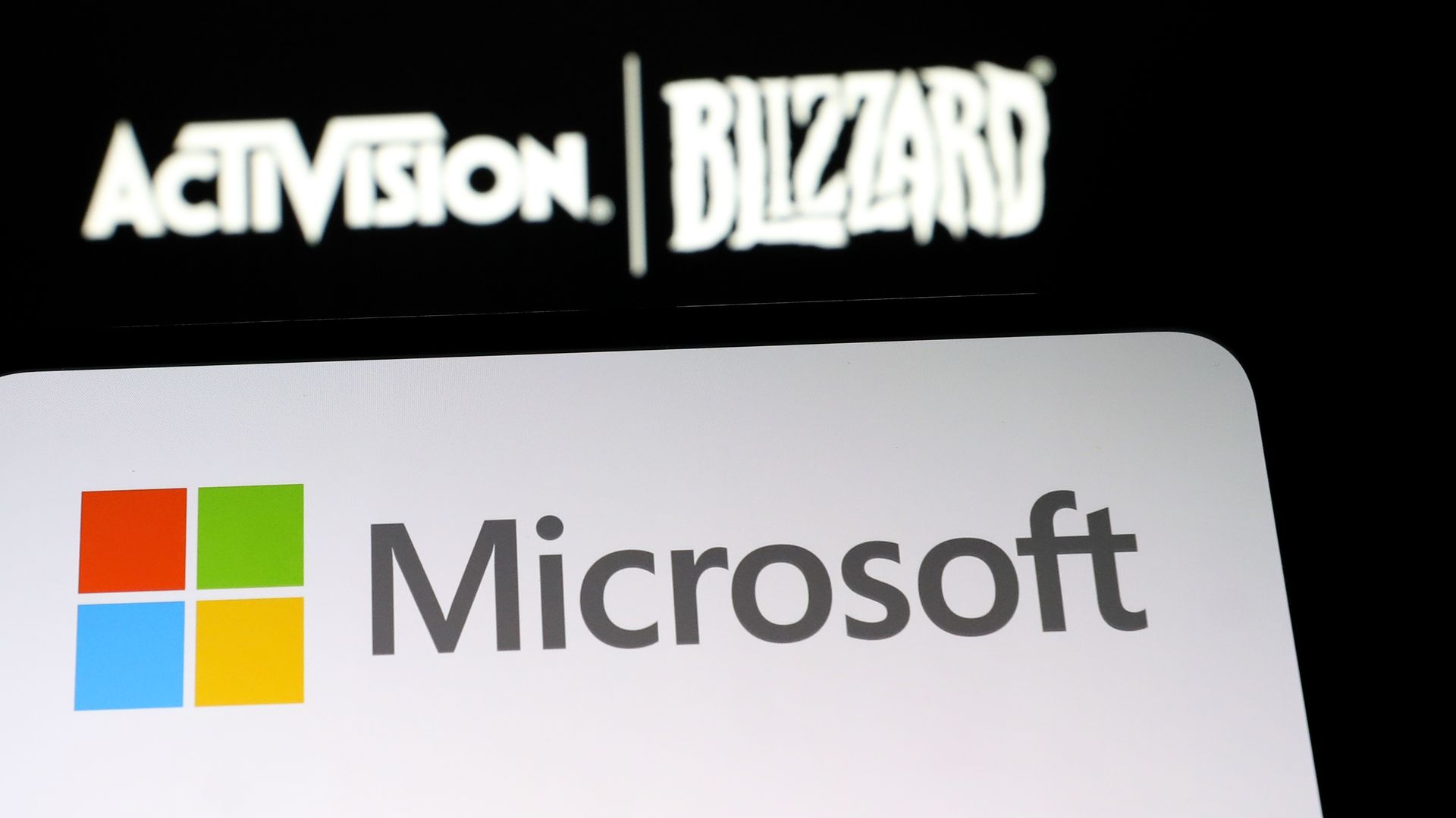 In this photo illustration, the logos of Microsoft and Activision Blizzard are displayed in Ankara, Turkiye on January 18, 2022. 