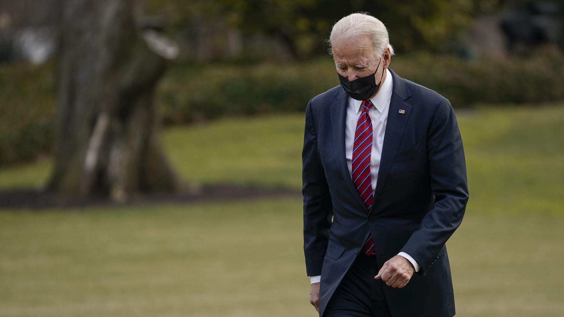 President Biden is seen walking back into the White House after arriving on Marine One.