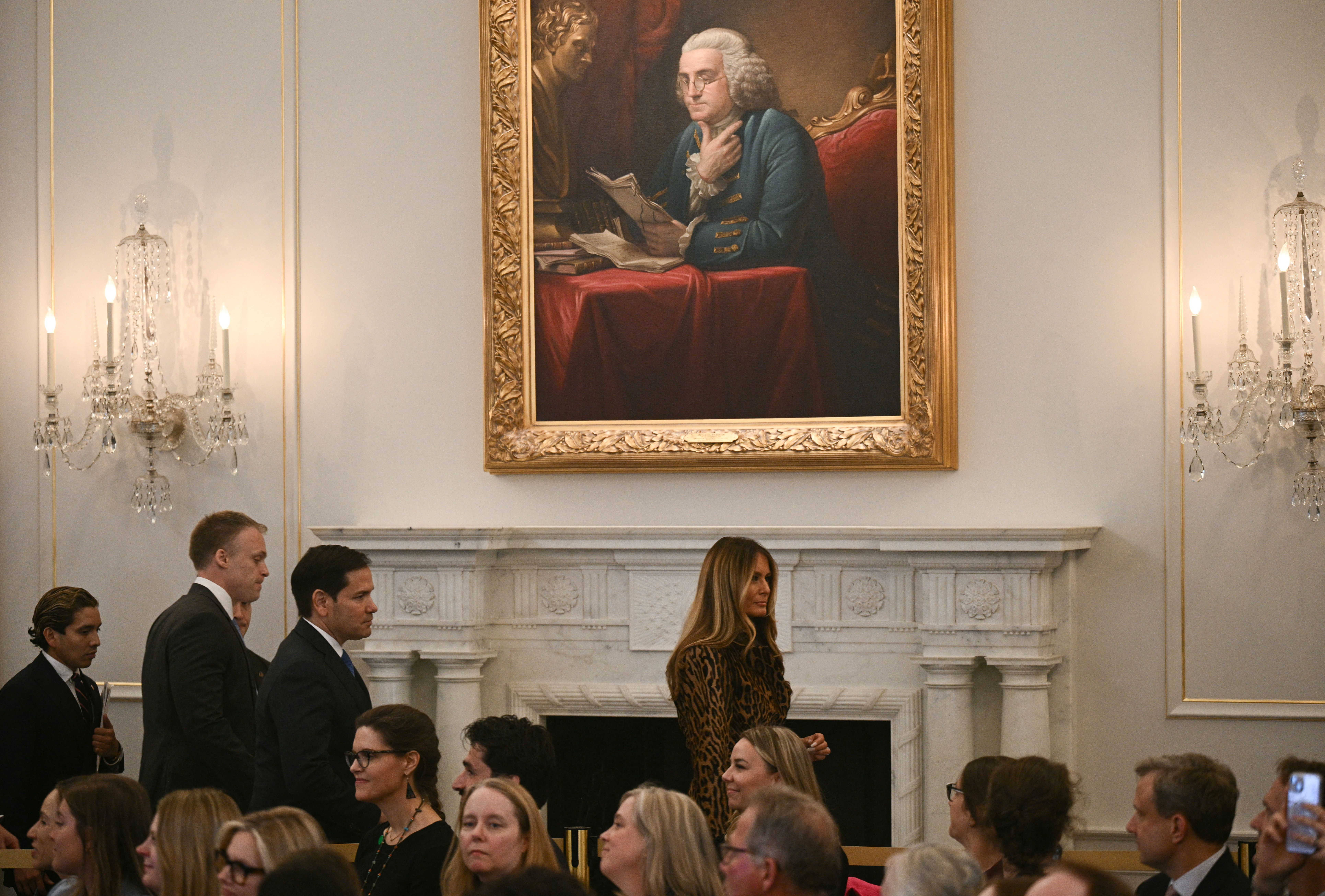   First Lady Melania Trump and Secretary of State Marco Rubio (3rd L) arrive to host the International Women of Courage Awards Ceremony as (C) looks on at the State Department in Washington, DC, on April 1, 2025. 