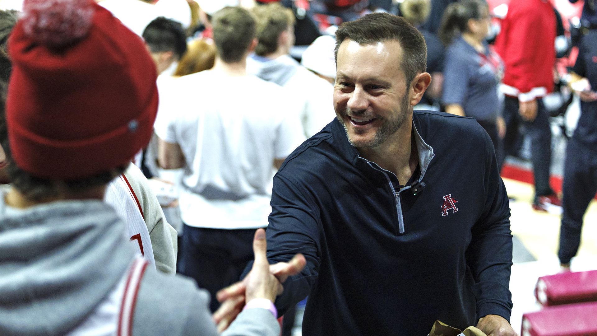 New Arkansas Razorback football Head Coach Ryan Silverfield shakes hands with students before a game against the Louisville Cardinals at Bud Walton Arena on December 03, 2025 in Fayetteville, Arkansas. (Photo by Wesley Hitt/Getty Images)