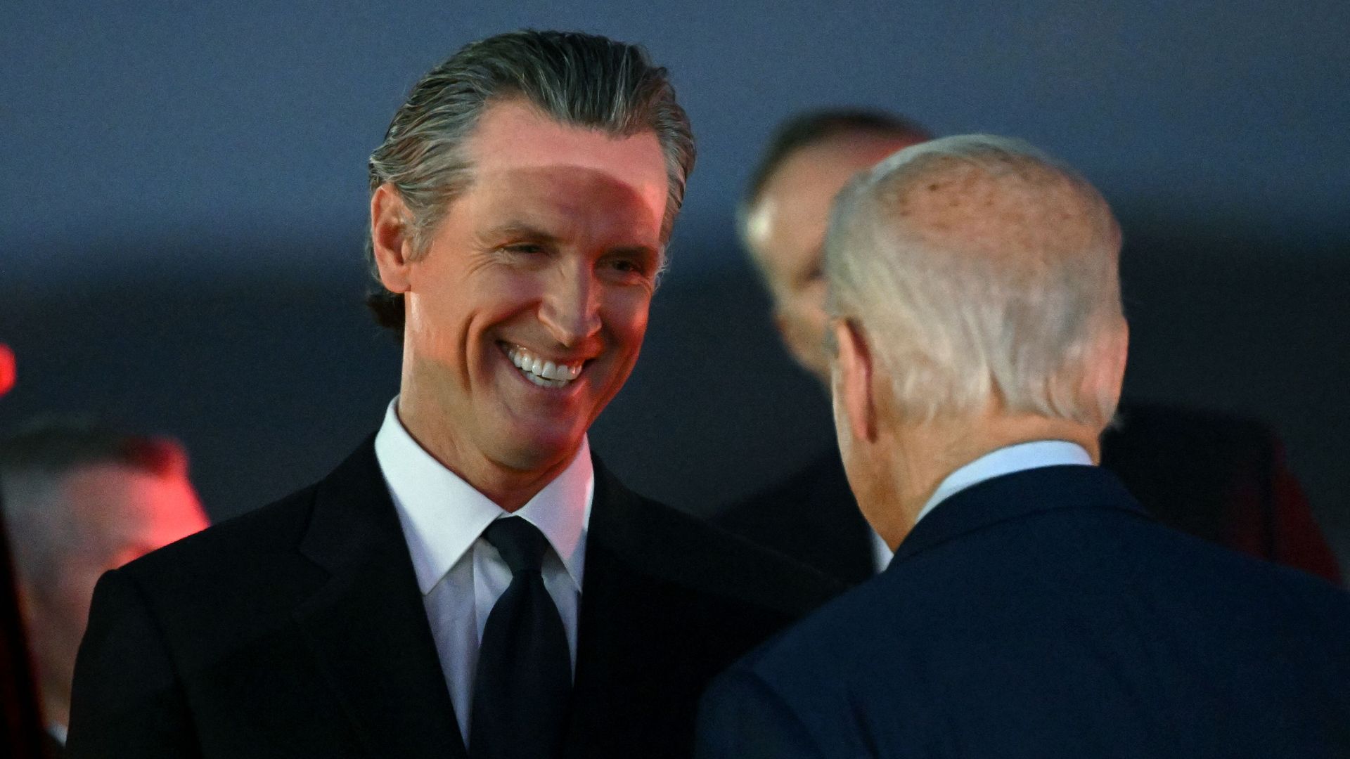 California Governor Gavin Newsom (L) greets US President Joe Biden upon arrival at Marine Corps Air Station Miramar in San Diego.