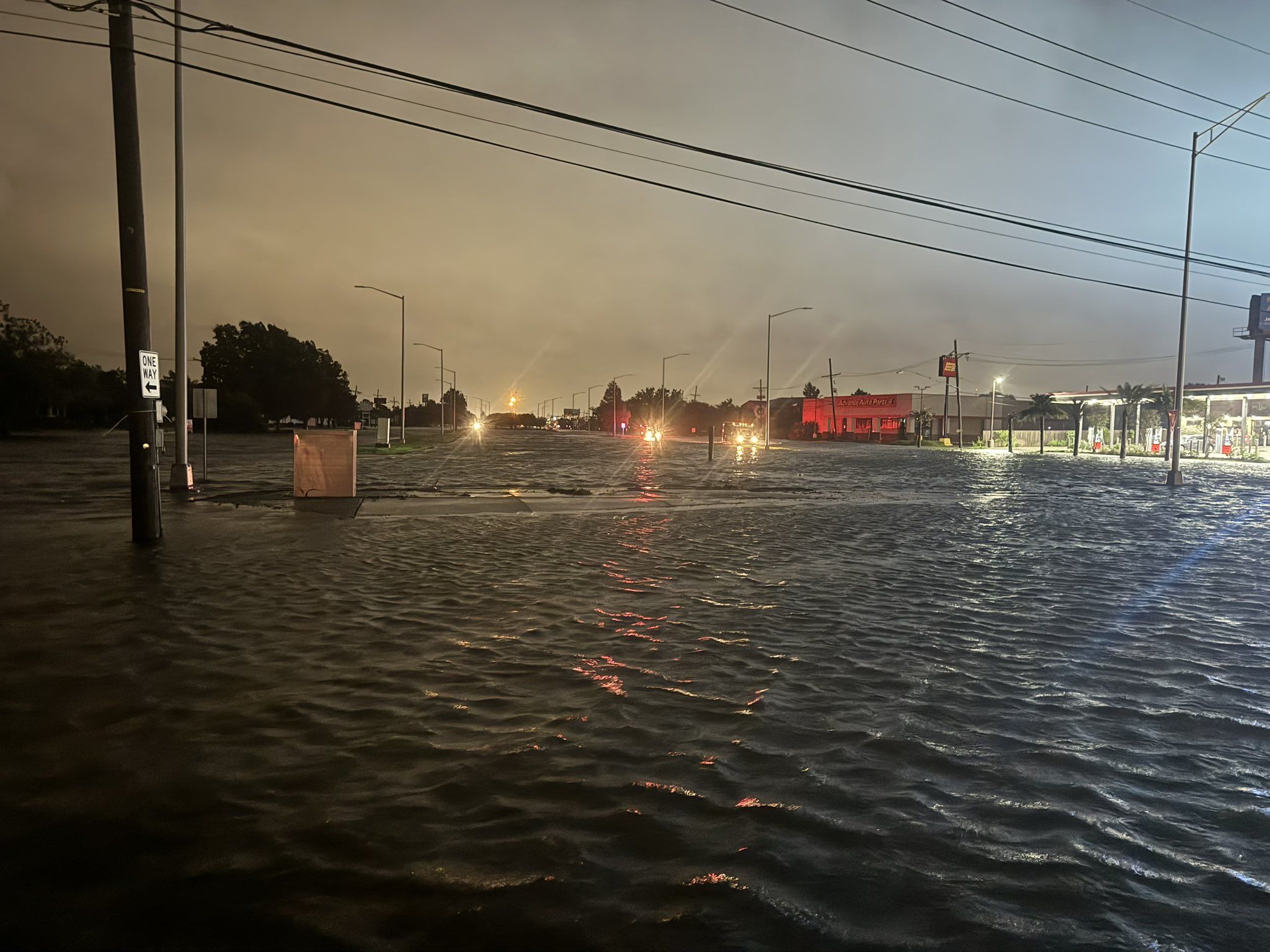 Street flooding across a wide intersection.