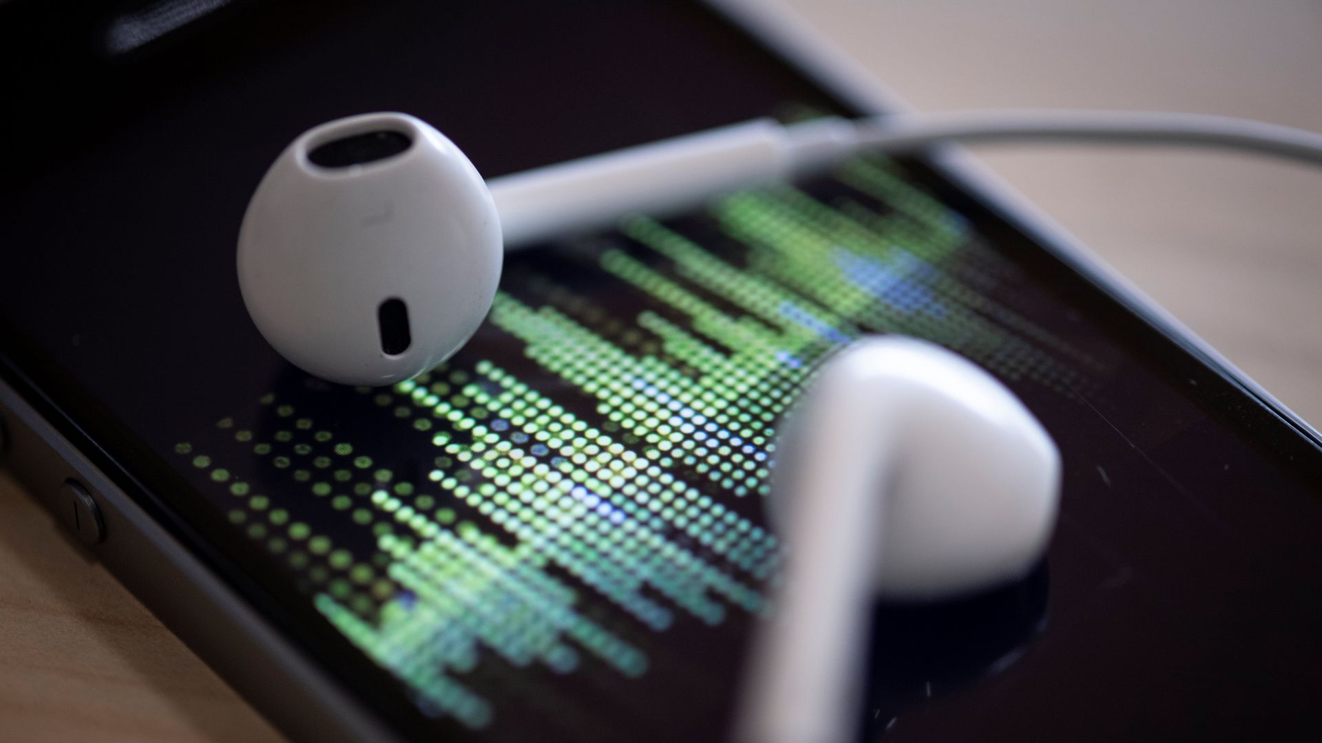 Two ear buds on a phone