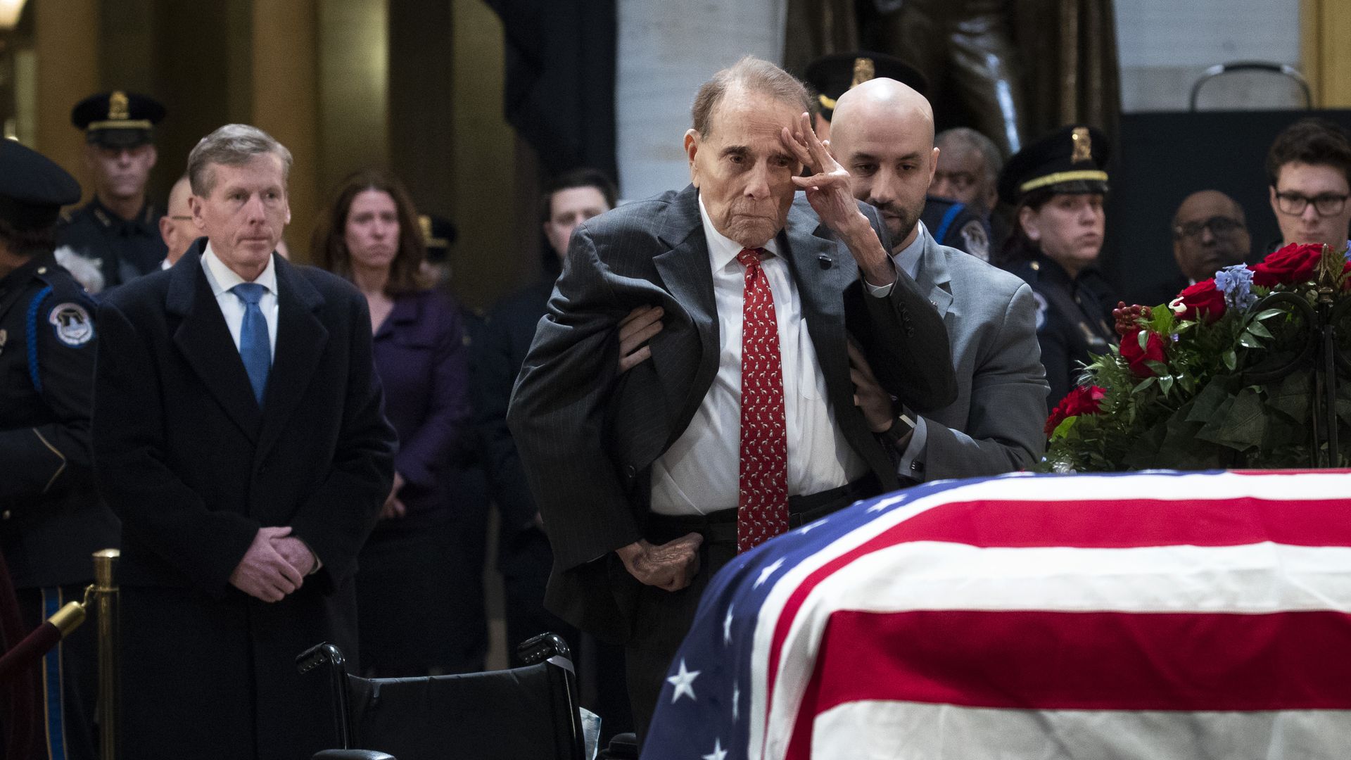 Bob Dole saluting casket of George W Bush