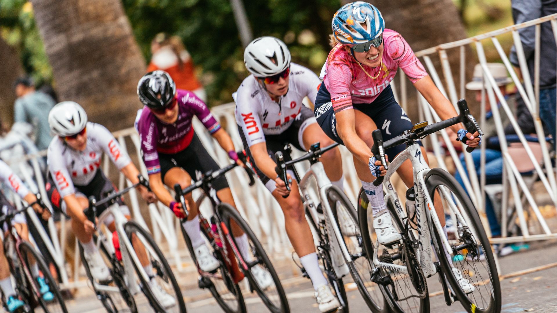 women cyclists mid-race