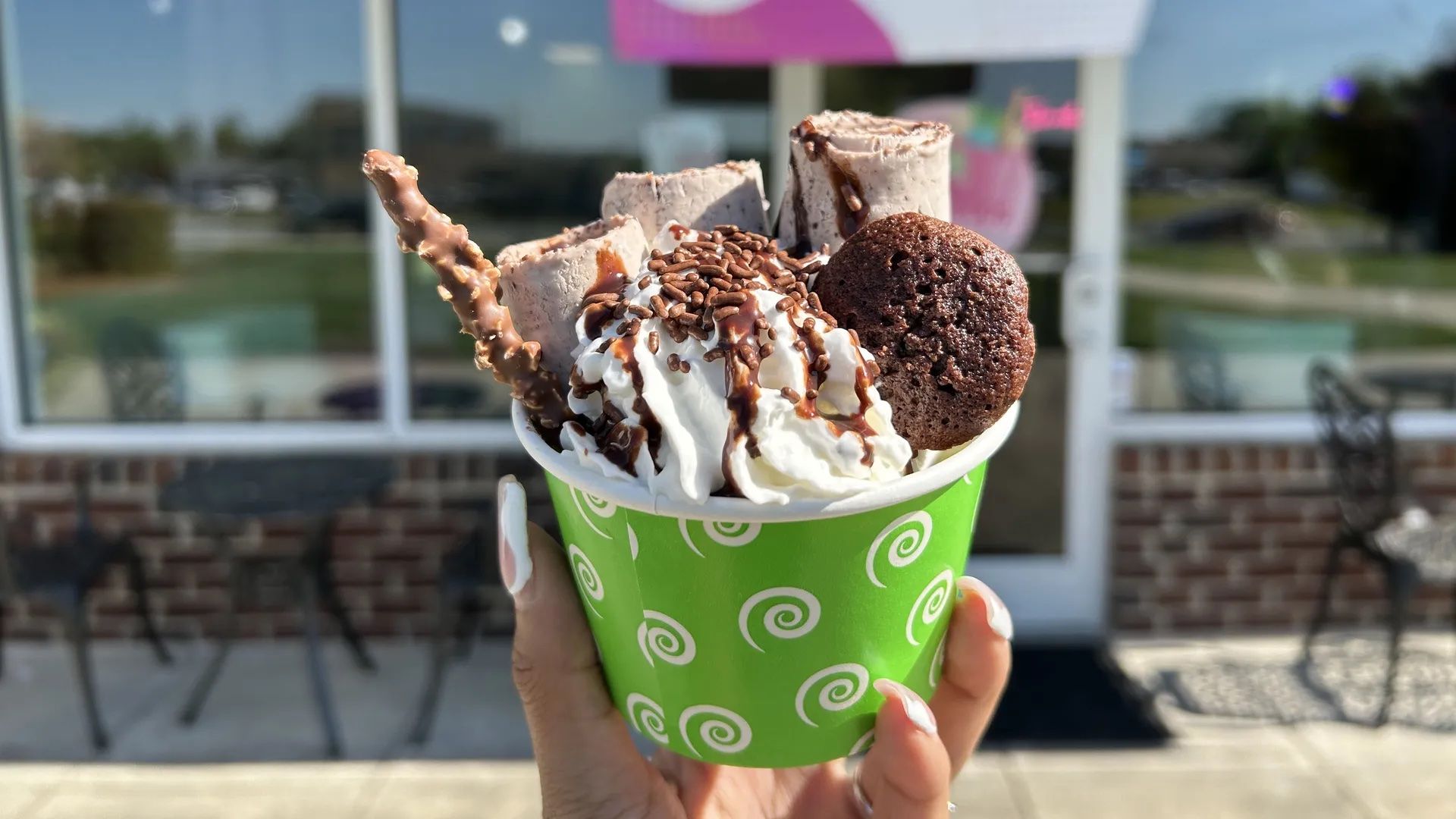 hand holding ice cream cup