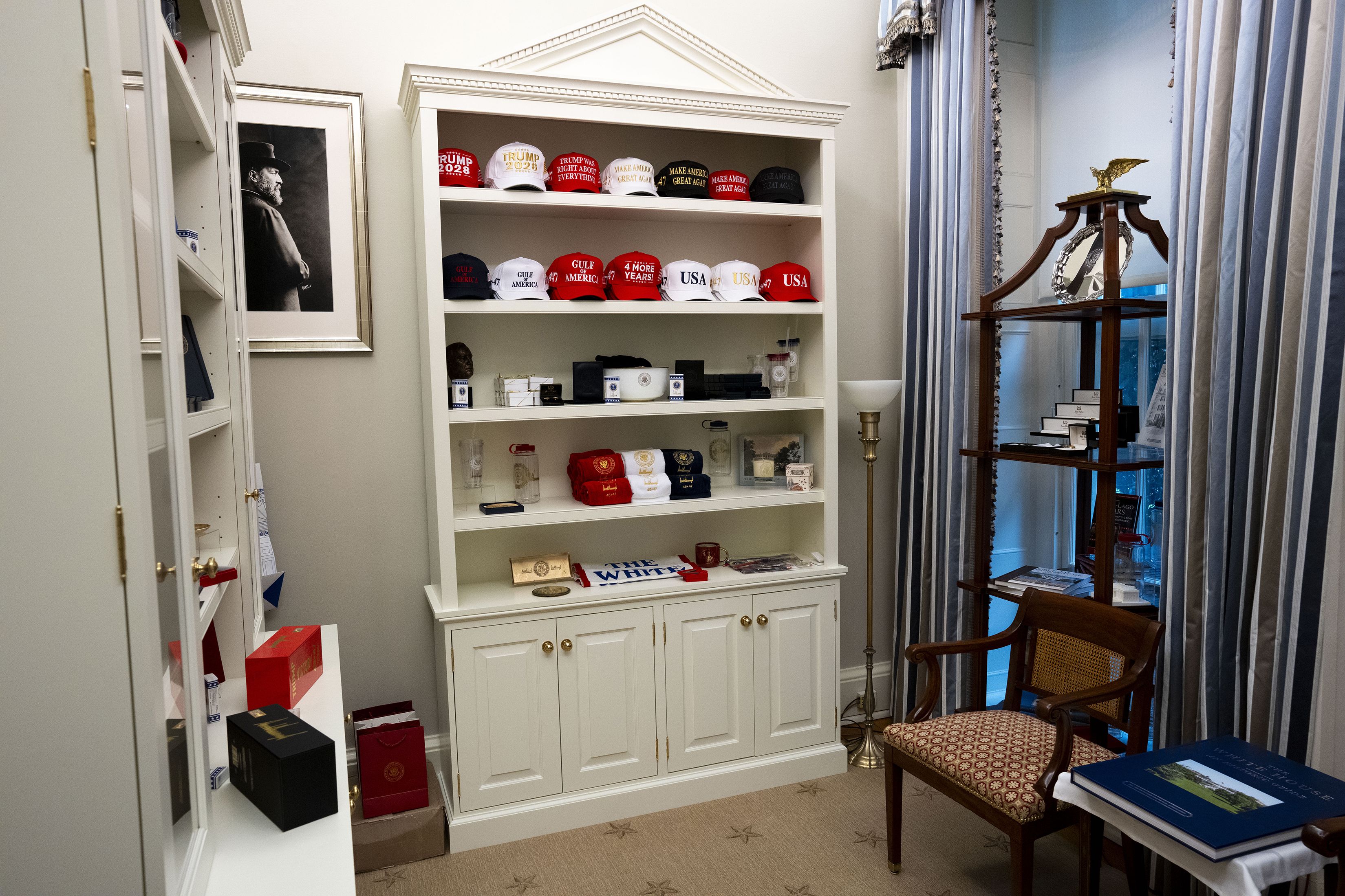 A display of President Donald Trump oriented merchandise and memorabilia in what is known as the Oval Office study, which he uses as a sort of gift room for some guests to the White House, in Washington, Oct. 13, 2025. The small room that is part of a suite connected to the Oval Office was utilized