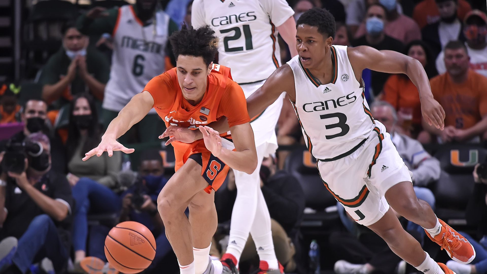 Two basketball players. One plays for Miami the other plays for Syracuse.