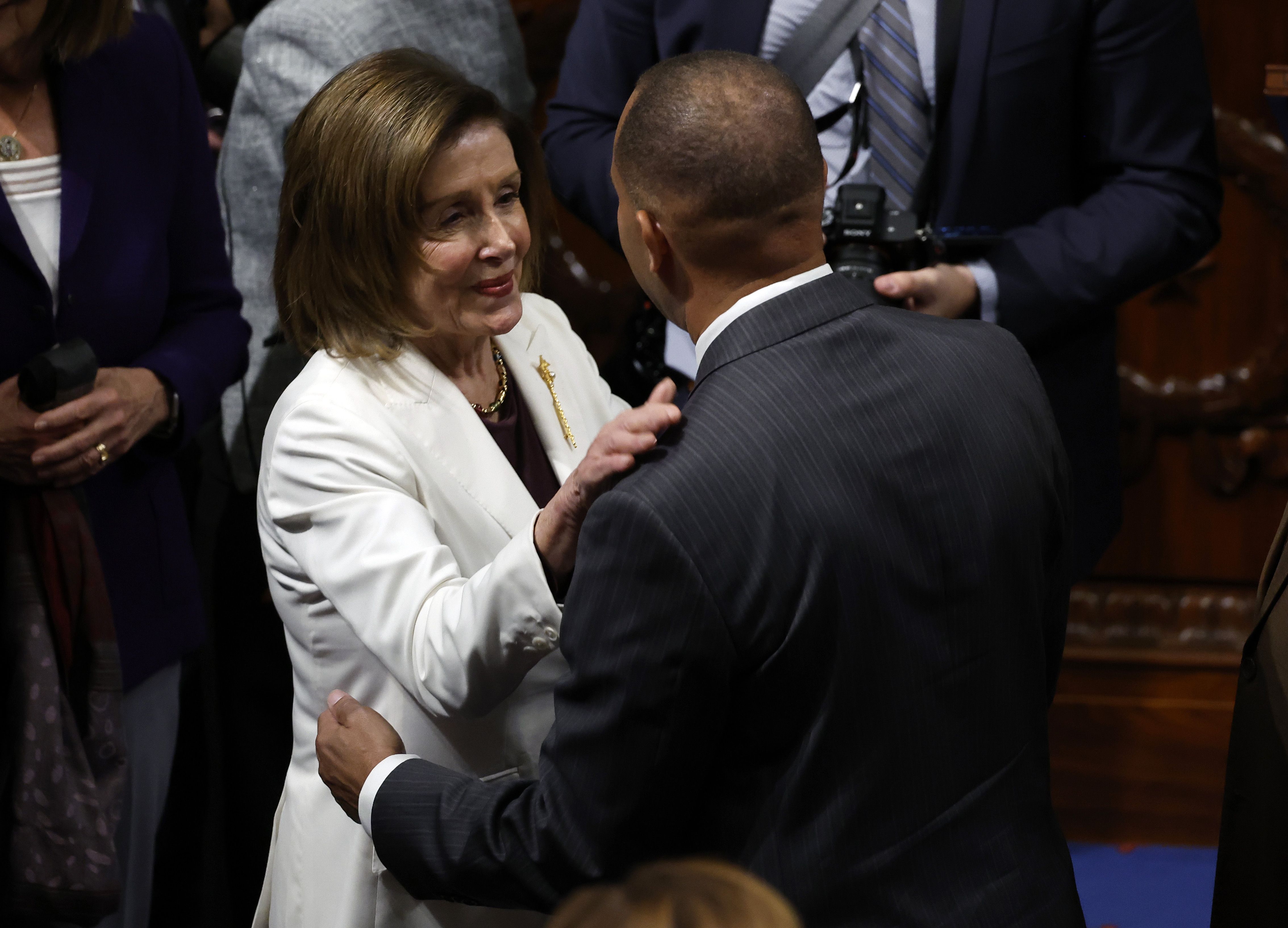 Nancy Pelosi embraces Hakeem Jeffries on the House floor