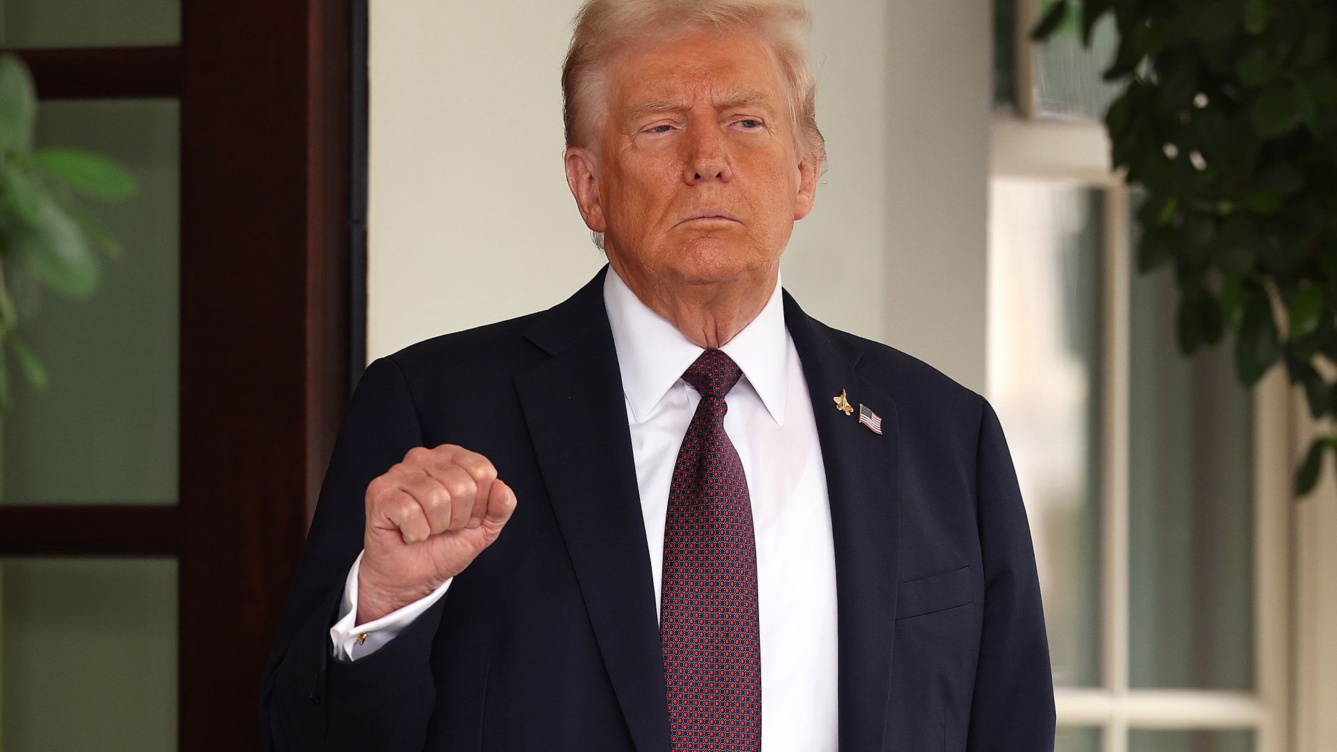 Don T with fist raised