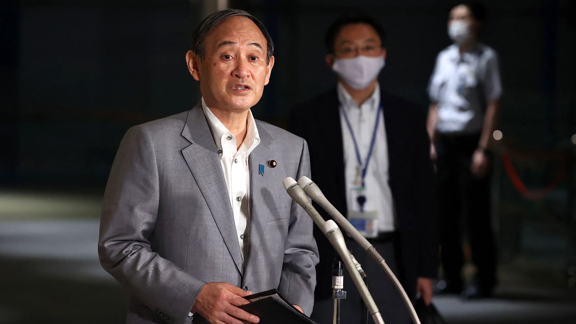  Japanese Prime Minister Yoshihide Suga speaking to reporters in Tokyo on July 7. 