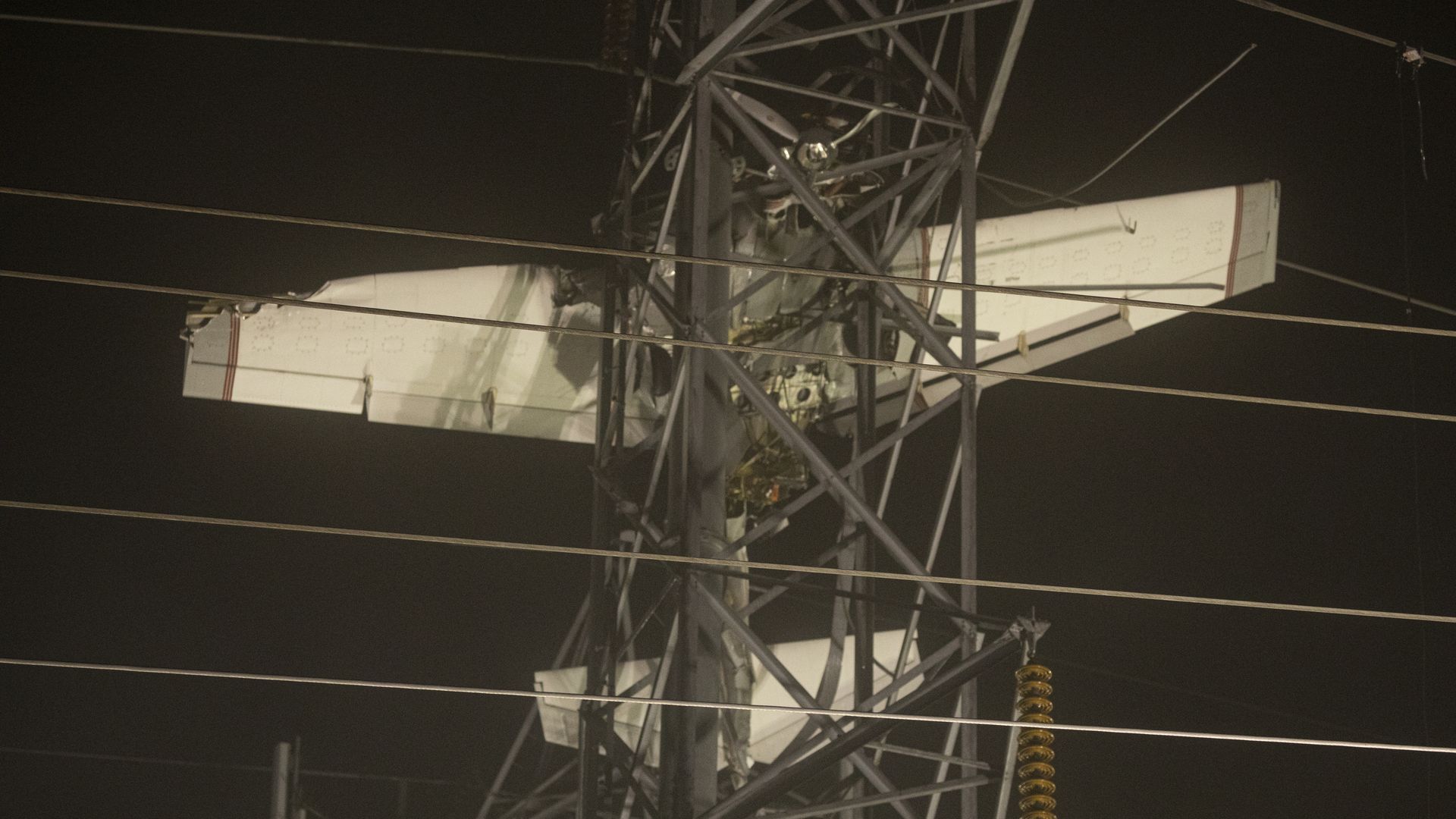 The plane lodged in the electric pole