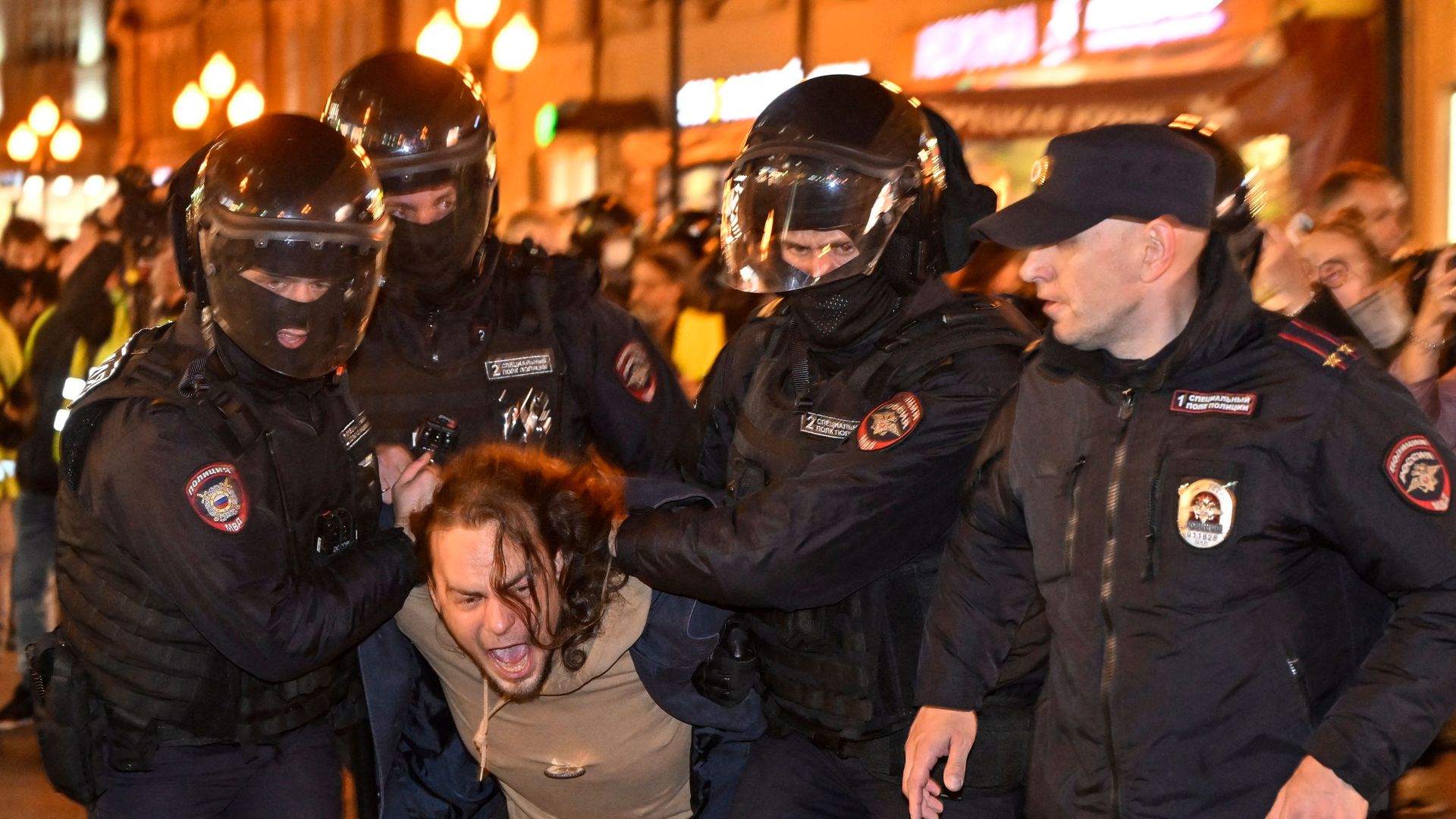 Police detaining a person in Moscow on Sept. 21 for participating in a demonstration against the mobilization order.