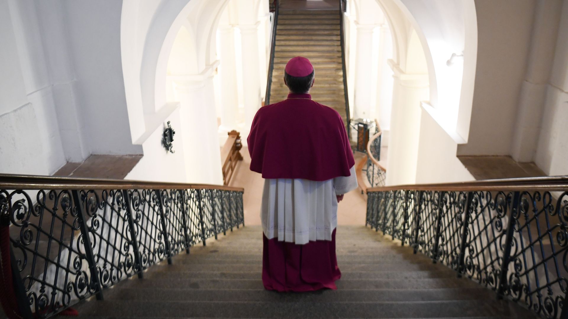 A German bishop is seen from behind.