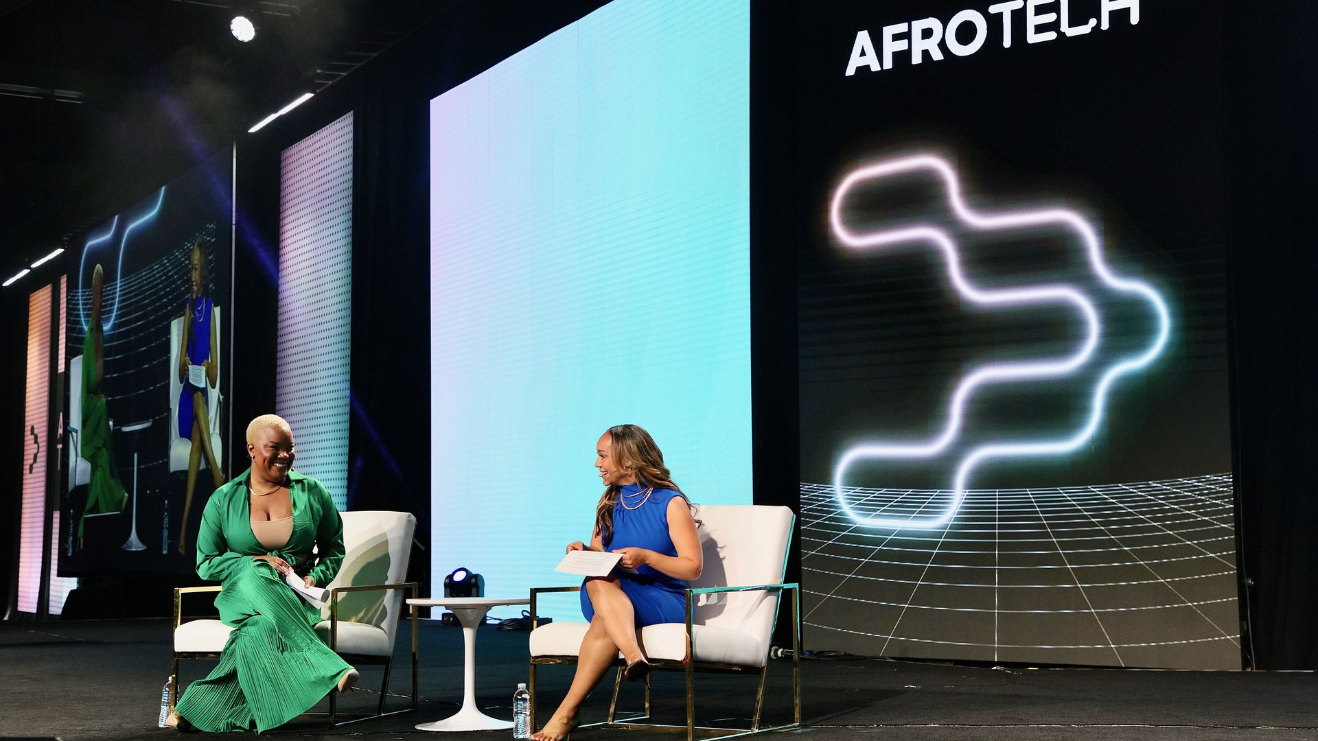 People participating in a session of the AfroTech conference.