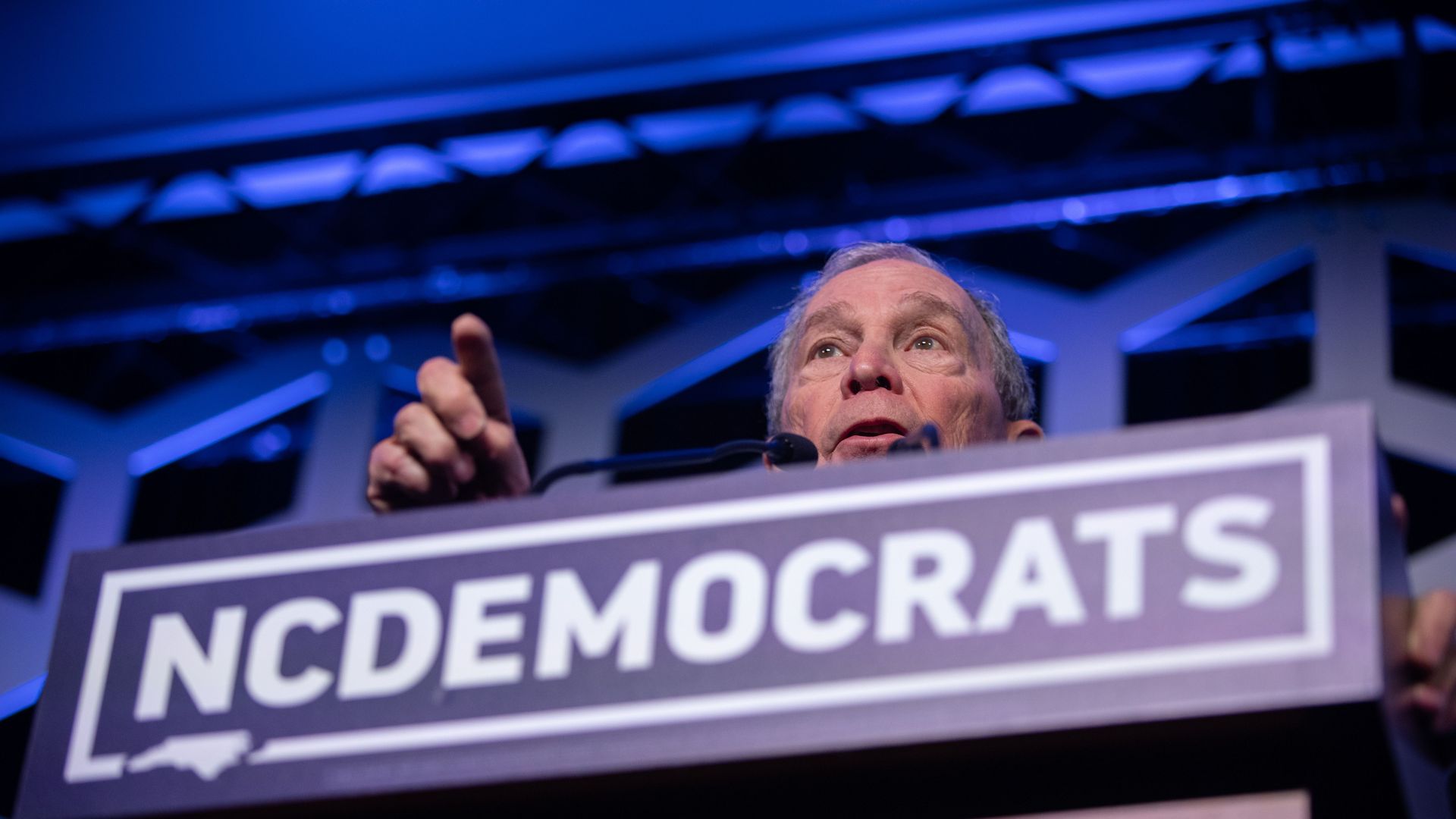 Michael Bloomberg, speaking from an NC Democrats podium