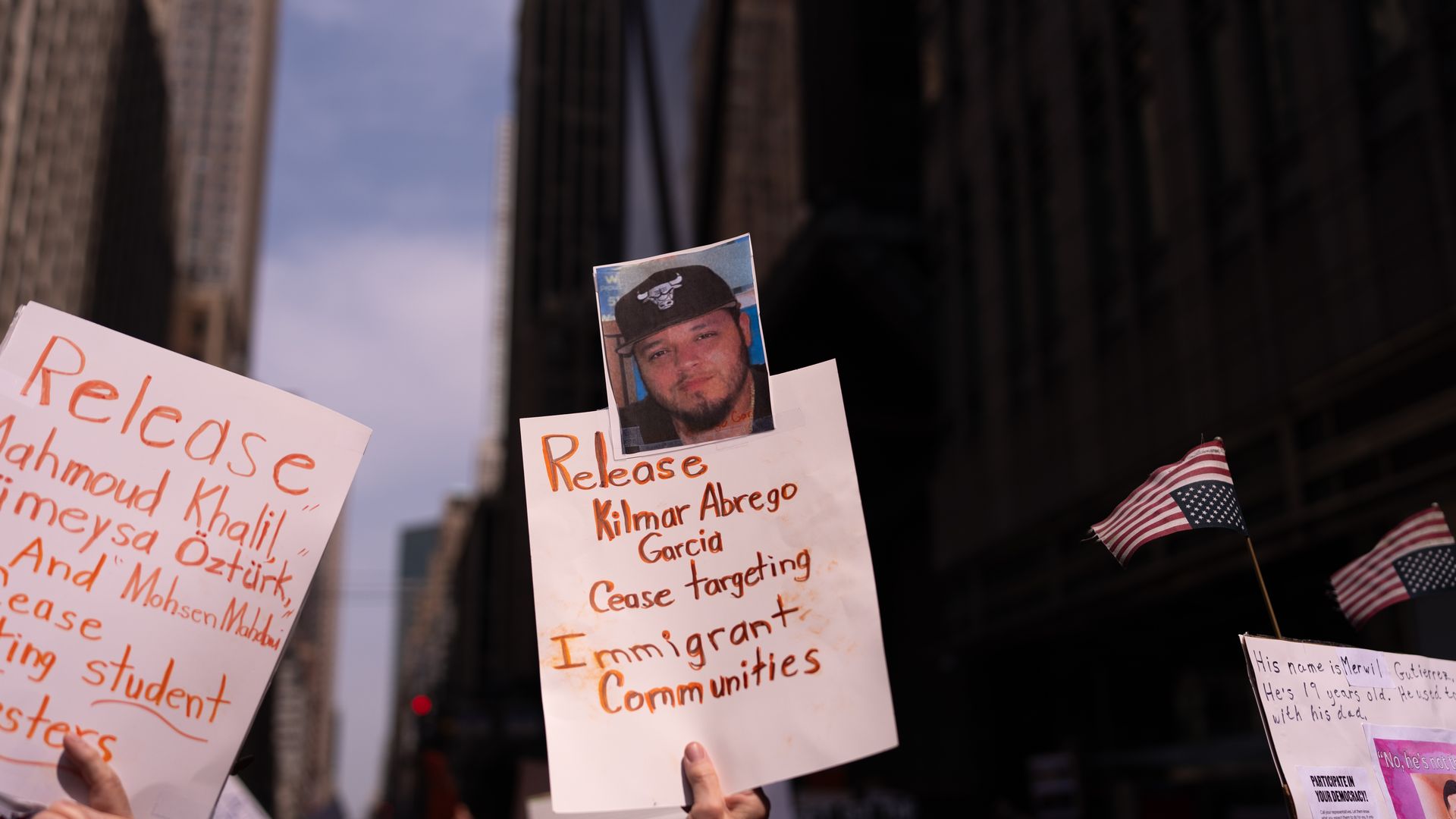 A person holds a sign with a photo of Kilmar Abrego Garcia as people take part in a protest organised to 'Protect Migrants, Protect the Planet' on April 19, 2025 in New York City. 