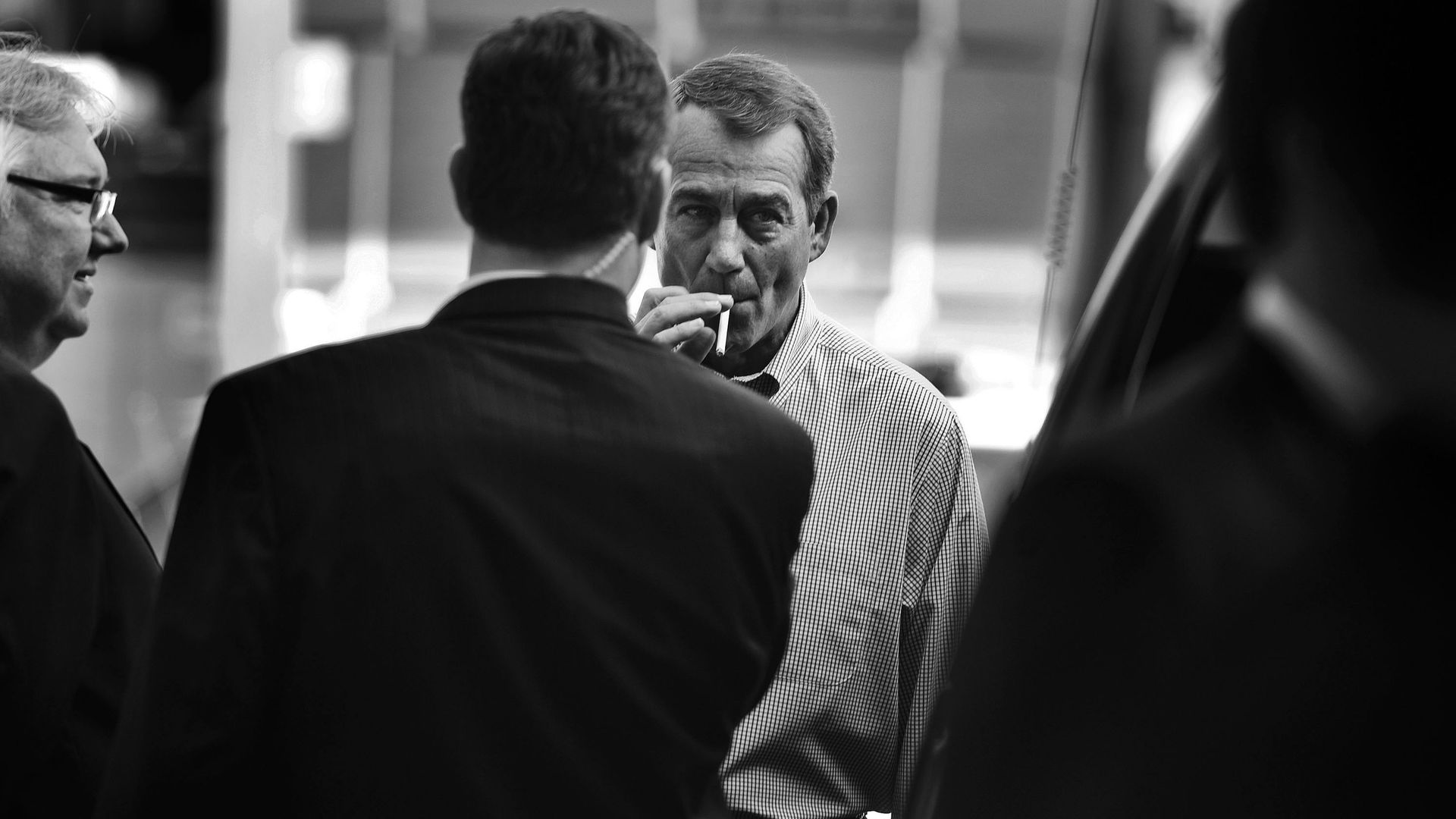 Then-House Minority Leader John Boehner is seen smoking a cigarette after an event in 2010.