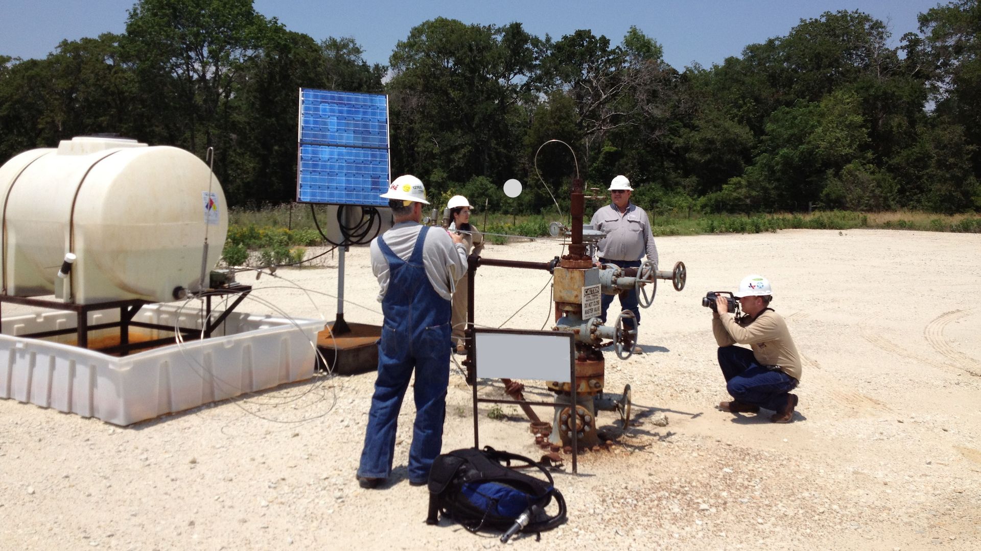 Researchers examine methane emissions from an oil or gas facility.
