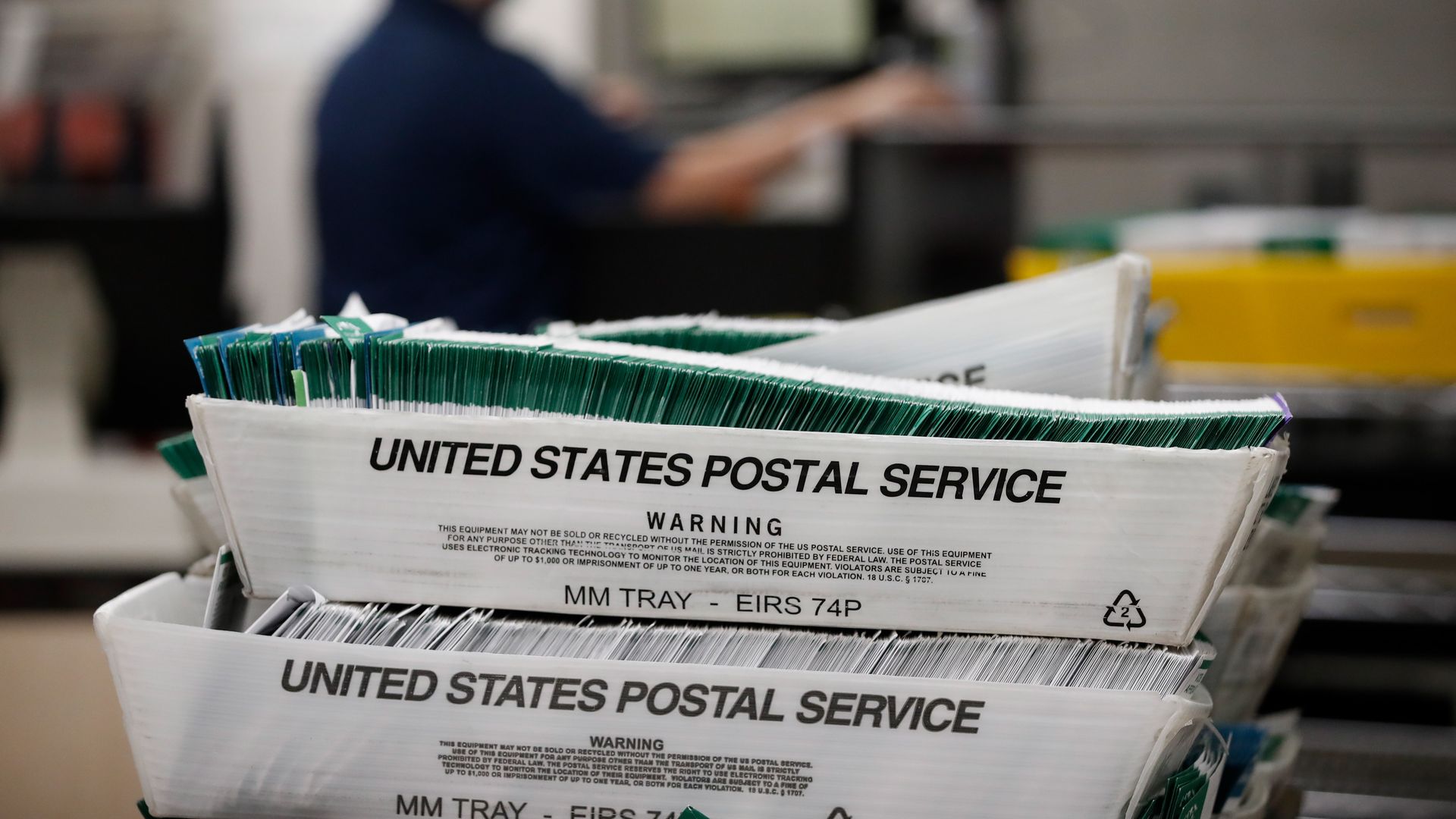 Picture of ballots in a USPS tray.
