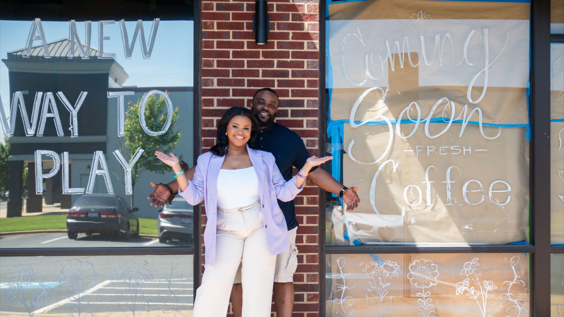 Owners of Grow Cafe pose outside the building. 