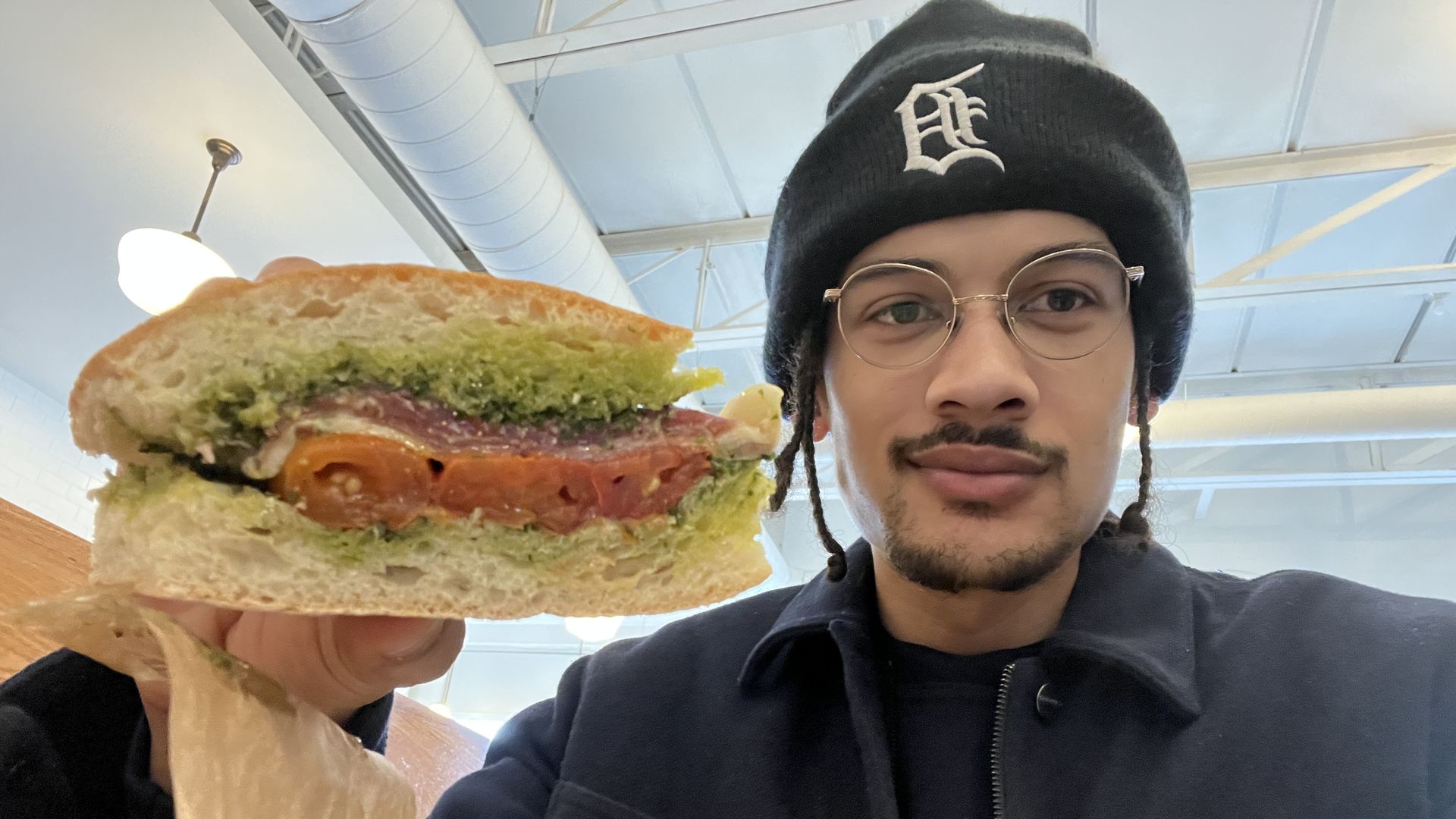 Sam holding the Prosciutto Love from Roccos